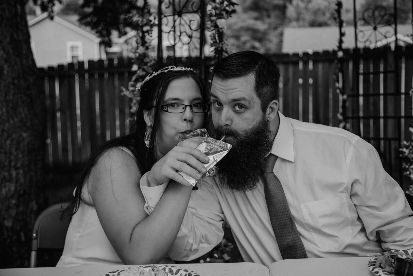 bride and groom drink juice box at arizona wedding
