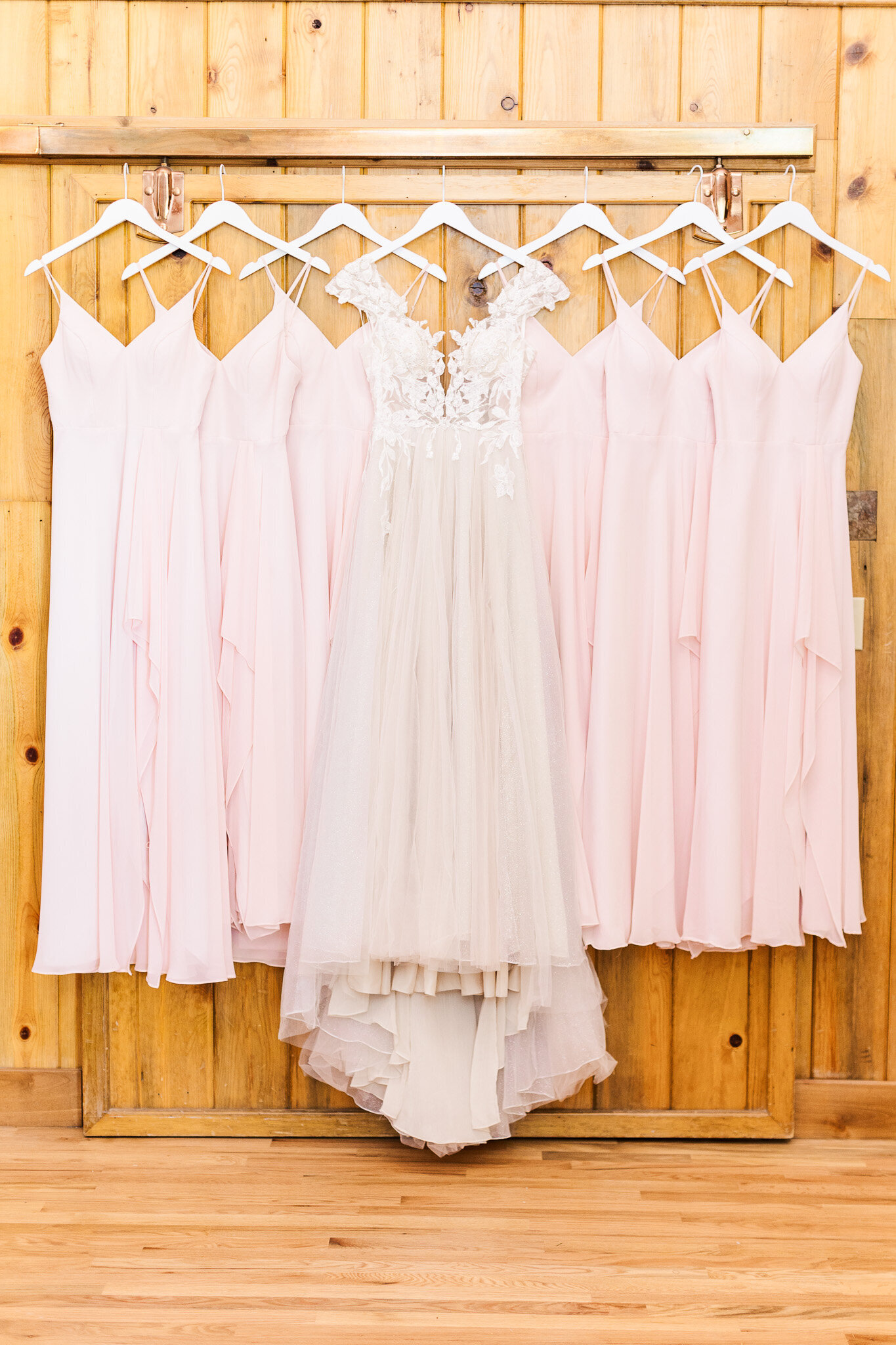 6 blush pink bridesmaids dresses with bridal gown