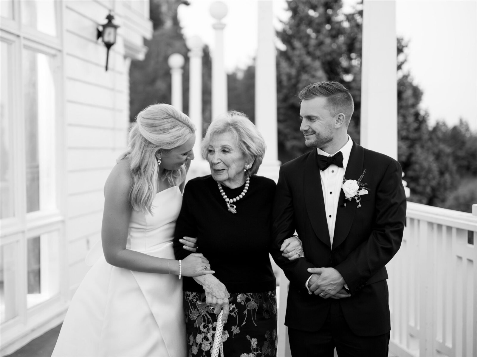 Bride and Groom standing with their Grandmother