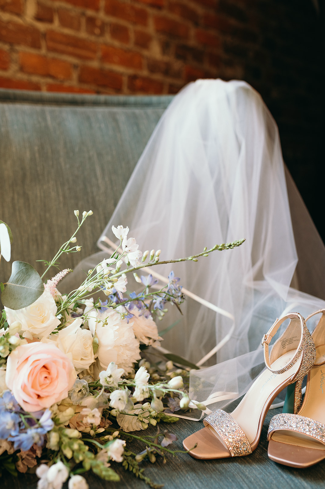 Bridal veil, wedding shows, and bouquet placed together | Megan Smith Photography