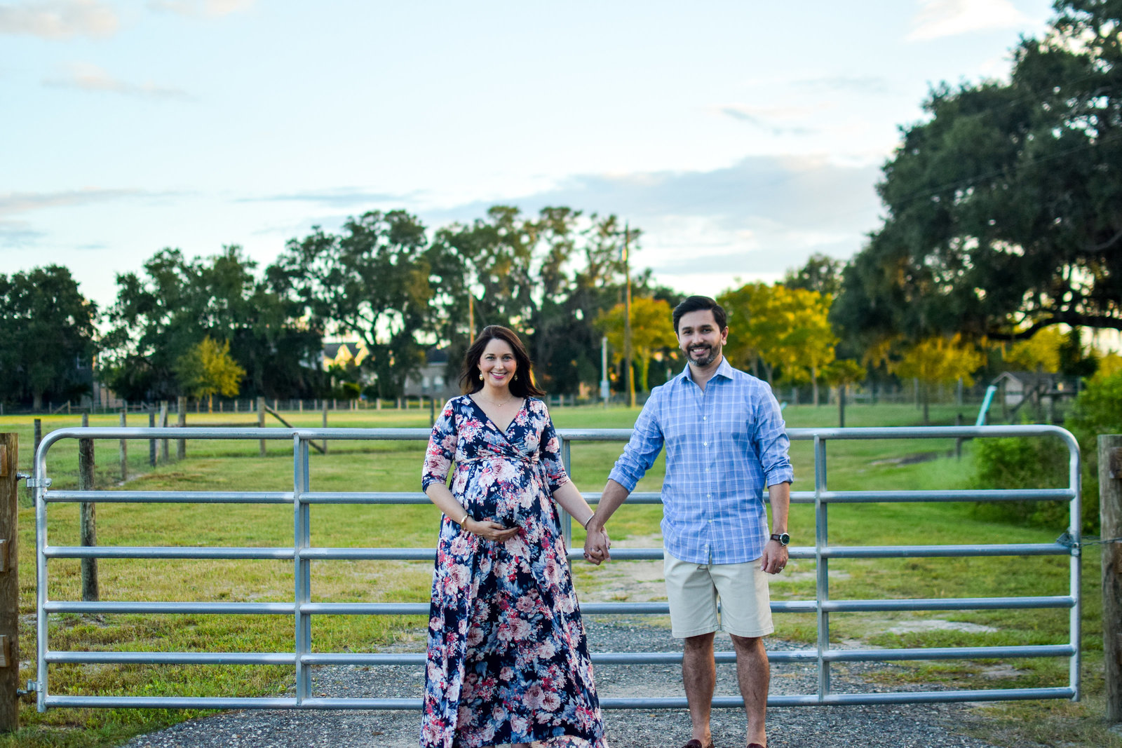 Maternity pregnant couple holding hands Tucker Ranch Winter Garden Florida