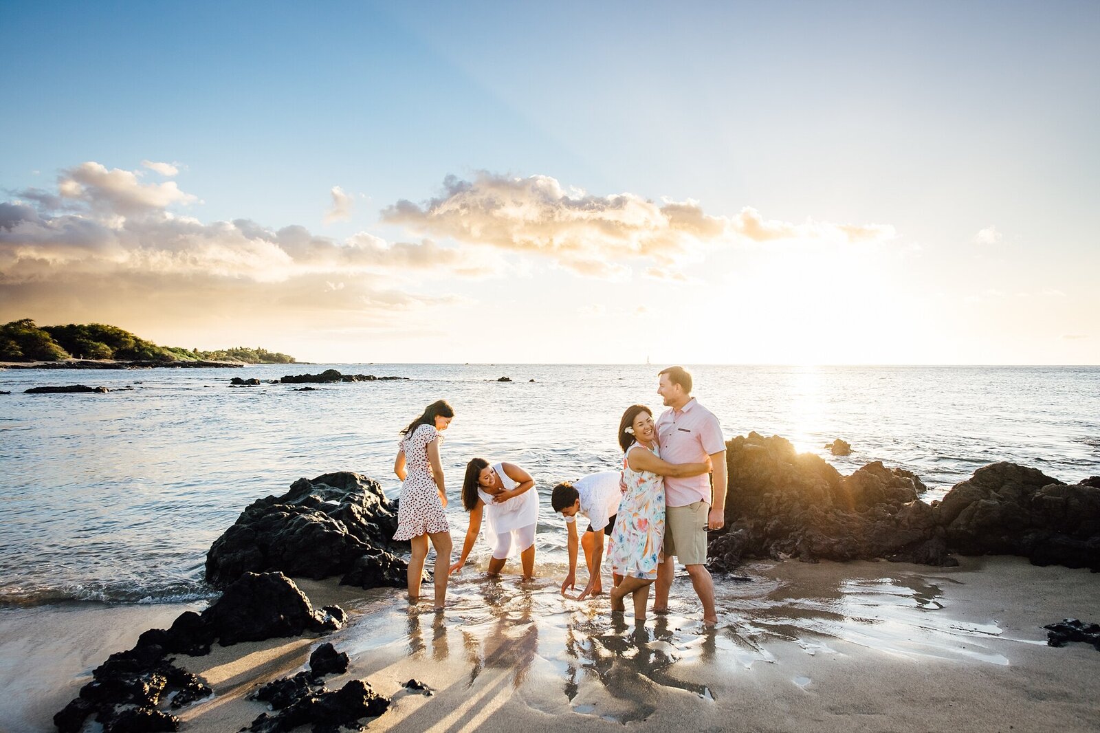 family of five playing on the beach
