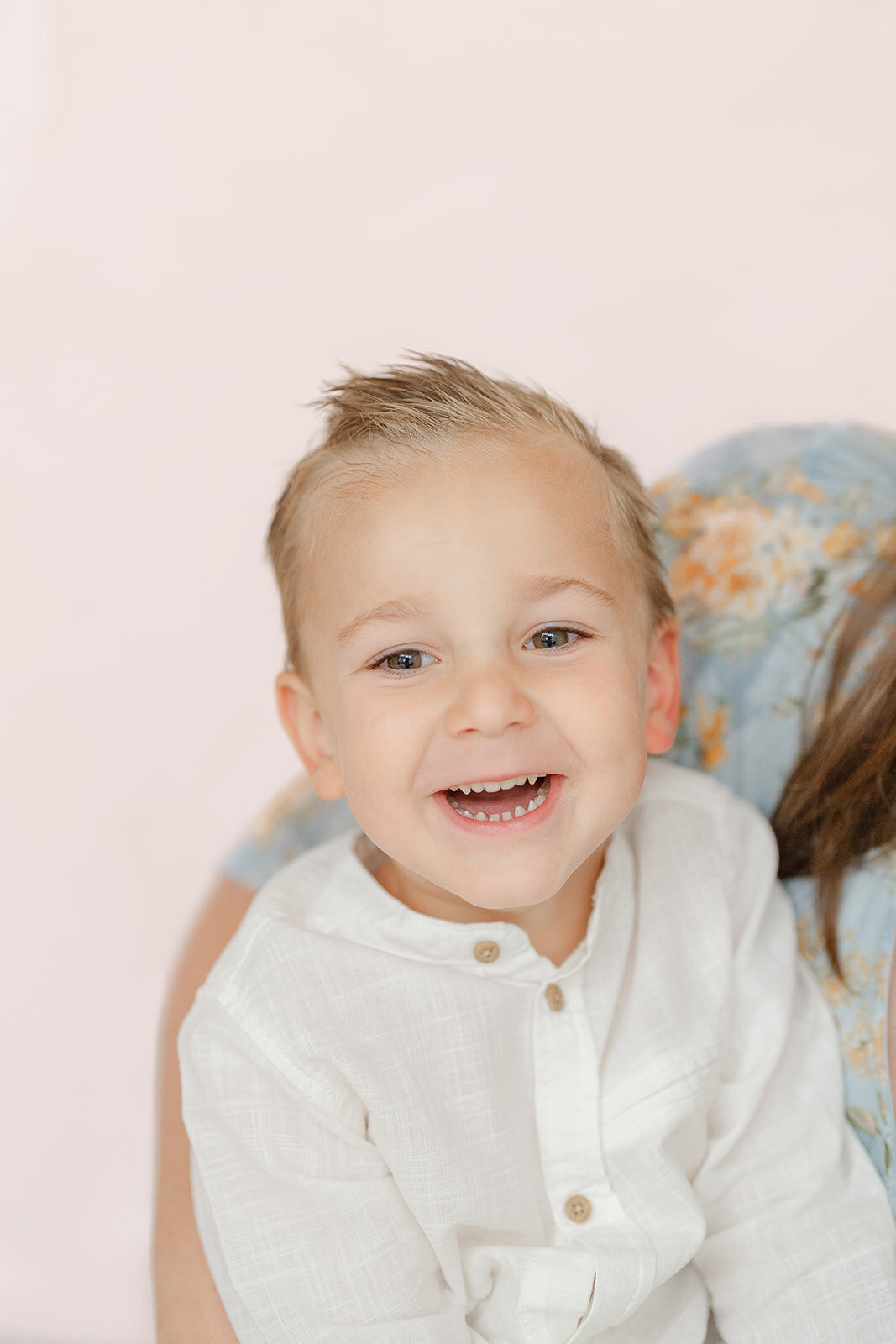 boy laughing during studio family photography in Gainesville, VA