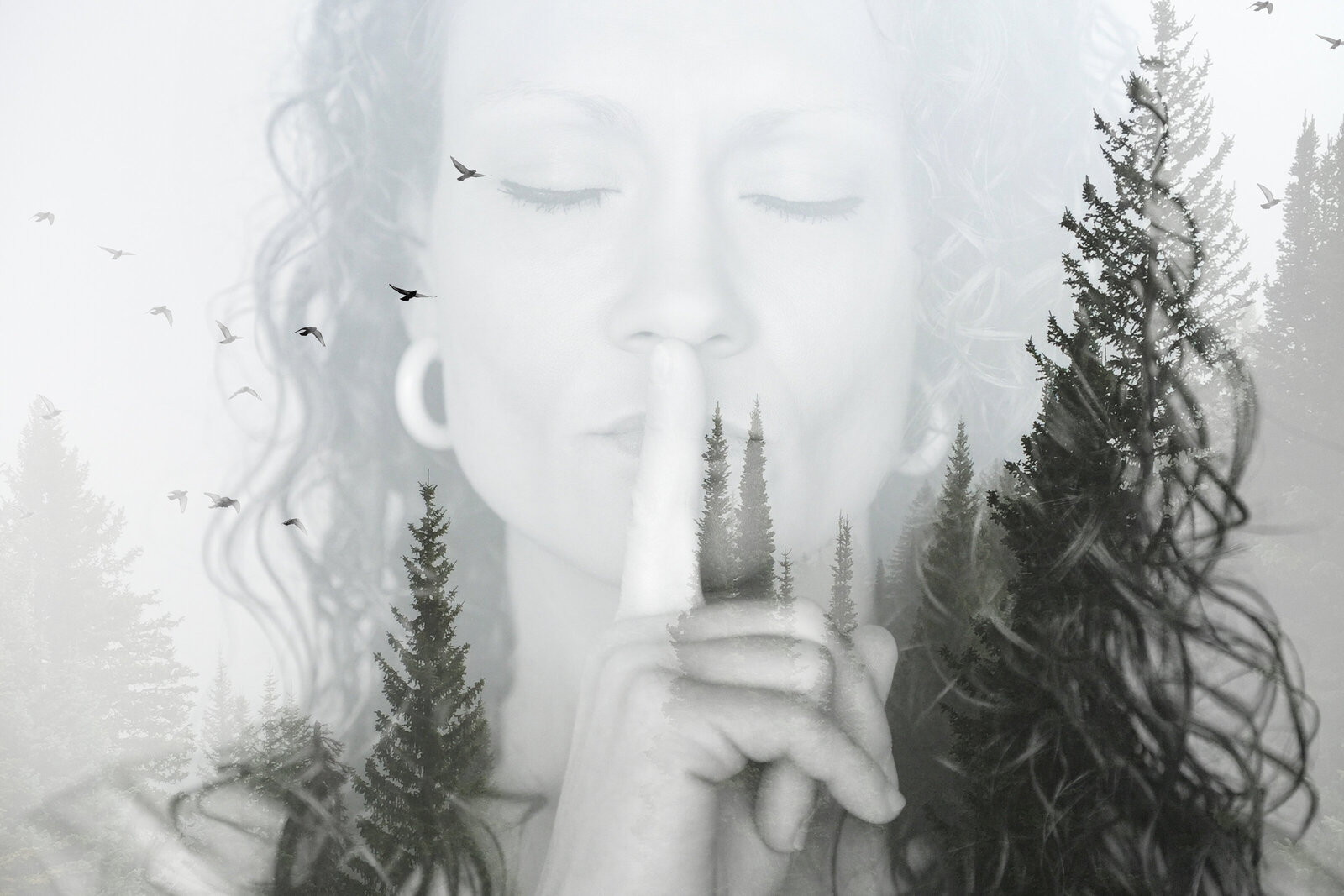 Double exposure of woman with shh hand, trees, and birds.