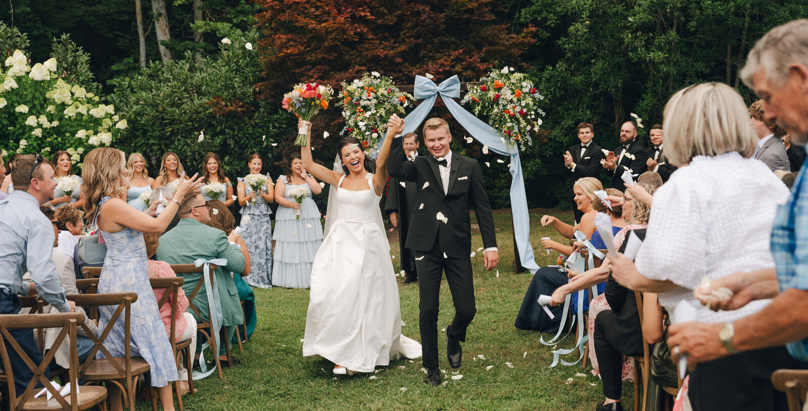 couple walking down the aisle at garden inspired Tennessee wedding venue 