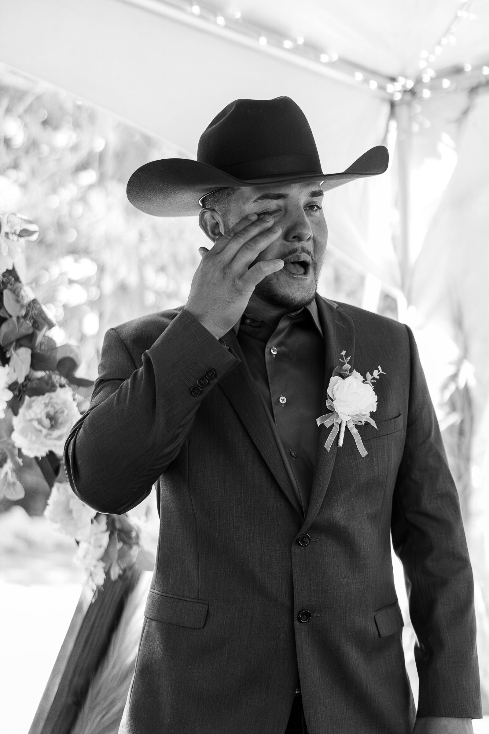 Emotional moment as the groom tears up watching his bride walk down the aisle at their Arrowhead Lodge wedding