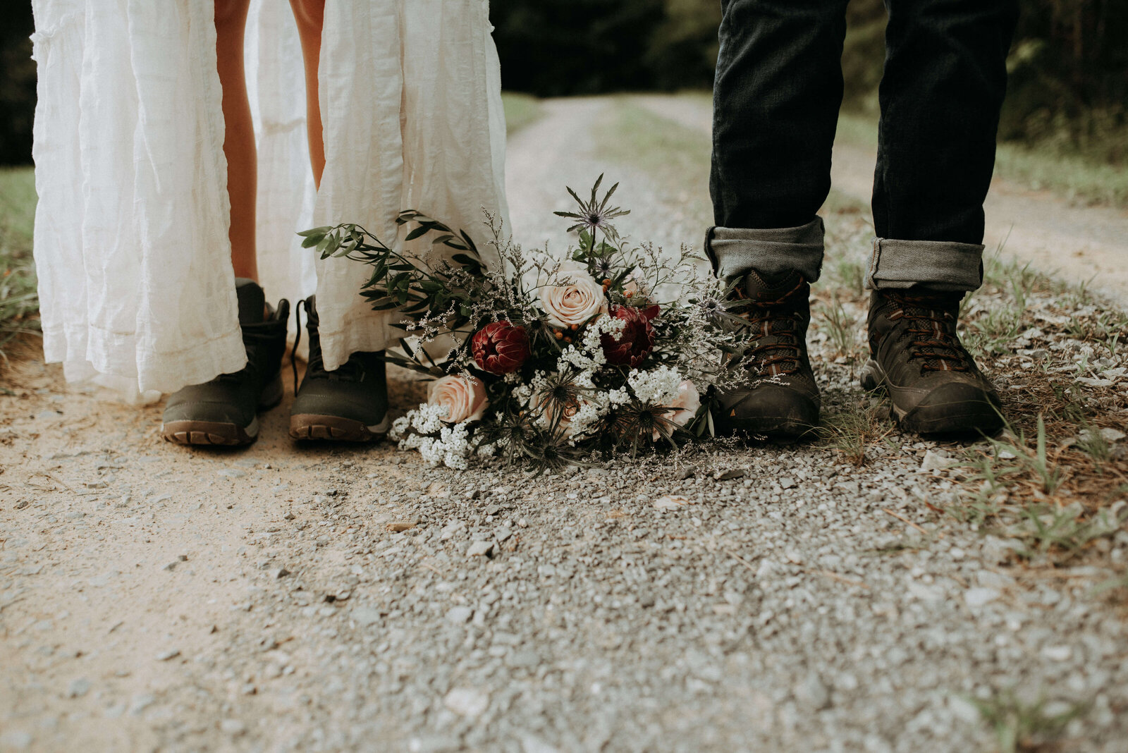bride and groom in boots for outdoor elopement