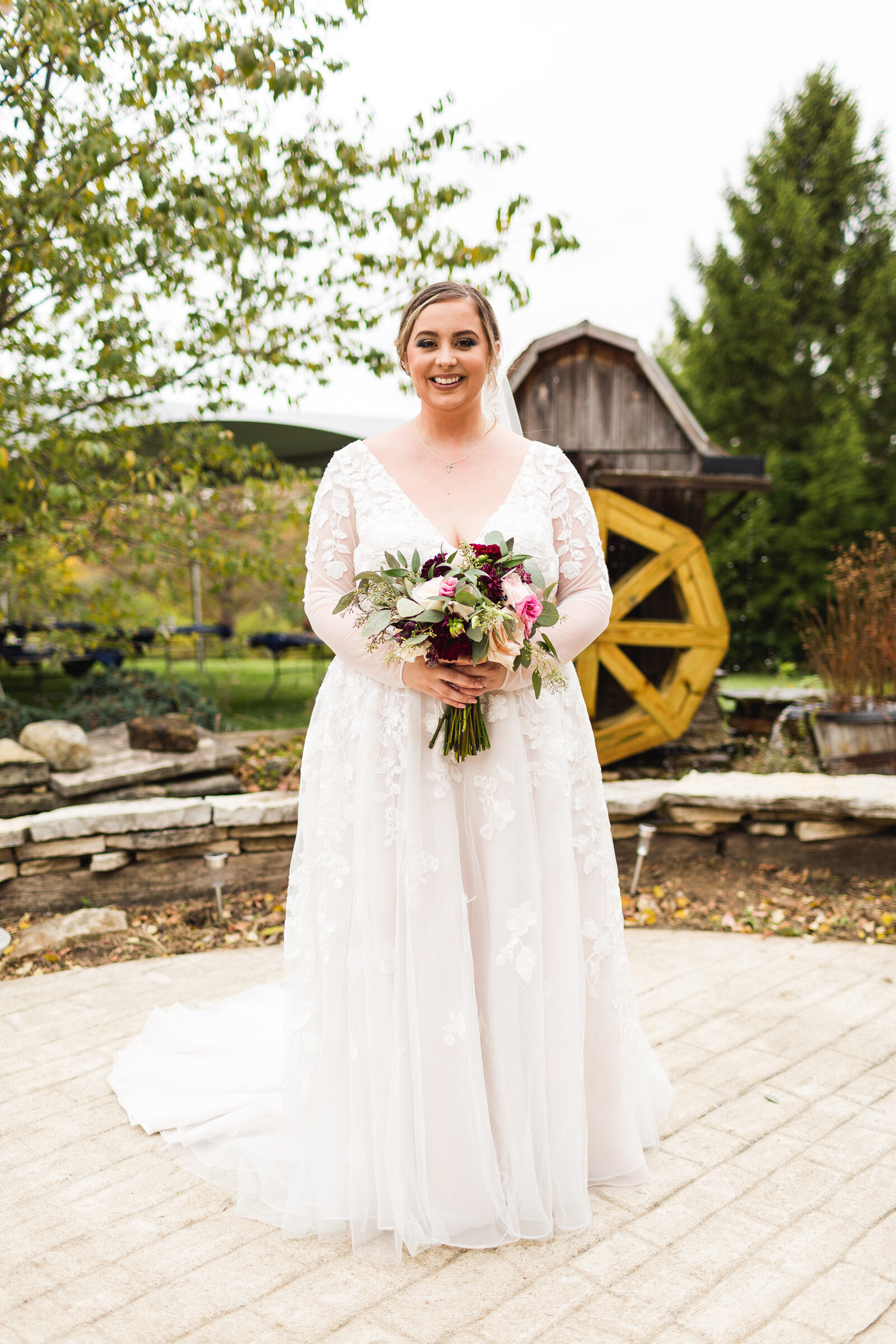 bride smiling for portrait with flowers rustic micro wedding ohio