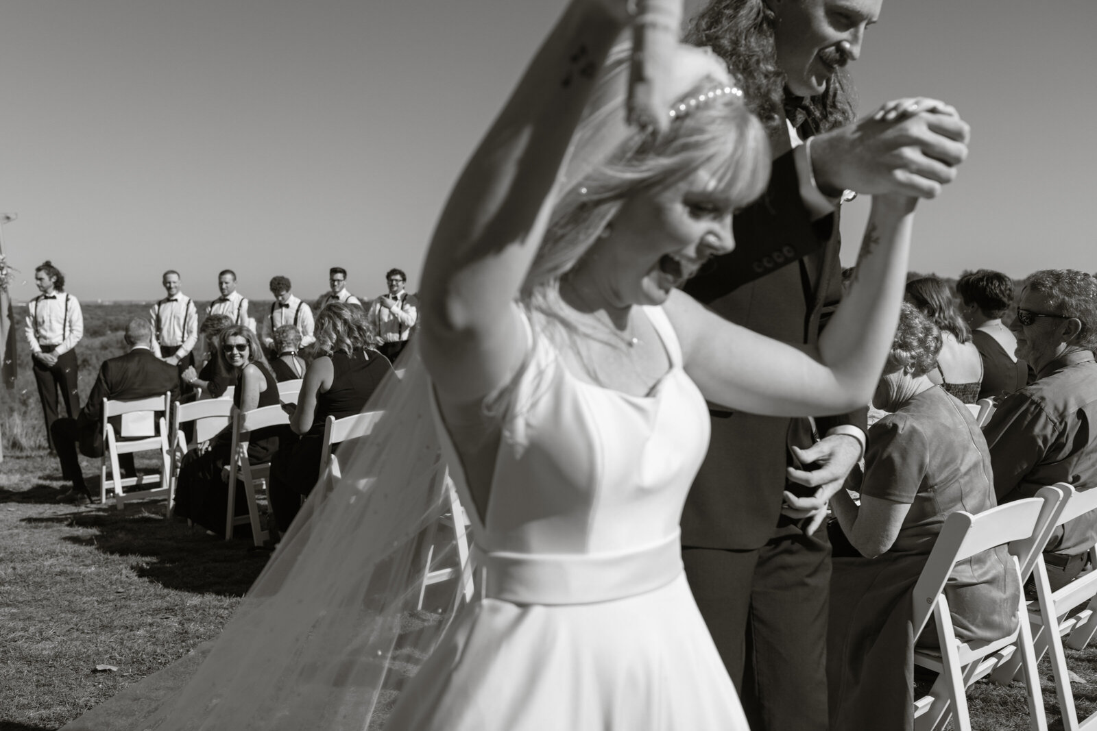 Happy couple leave wedding ceremony as a married couple. Took place at the gorgeous Ski hill.