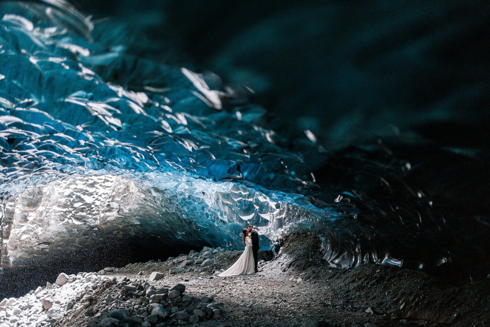 a couple getting married in an ice cave in iceland.