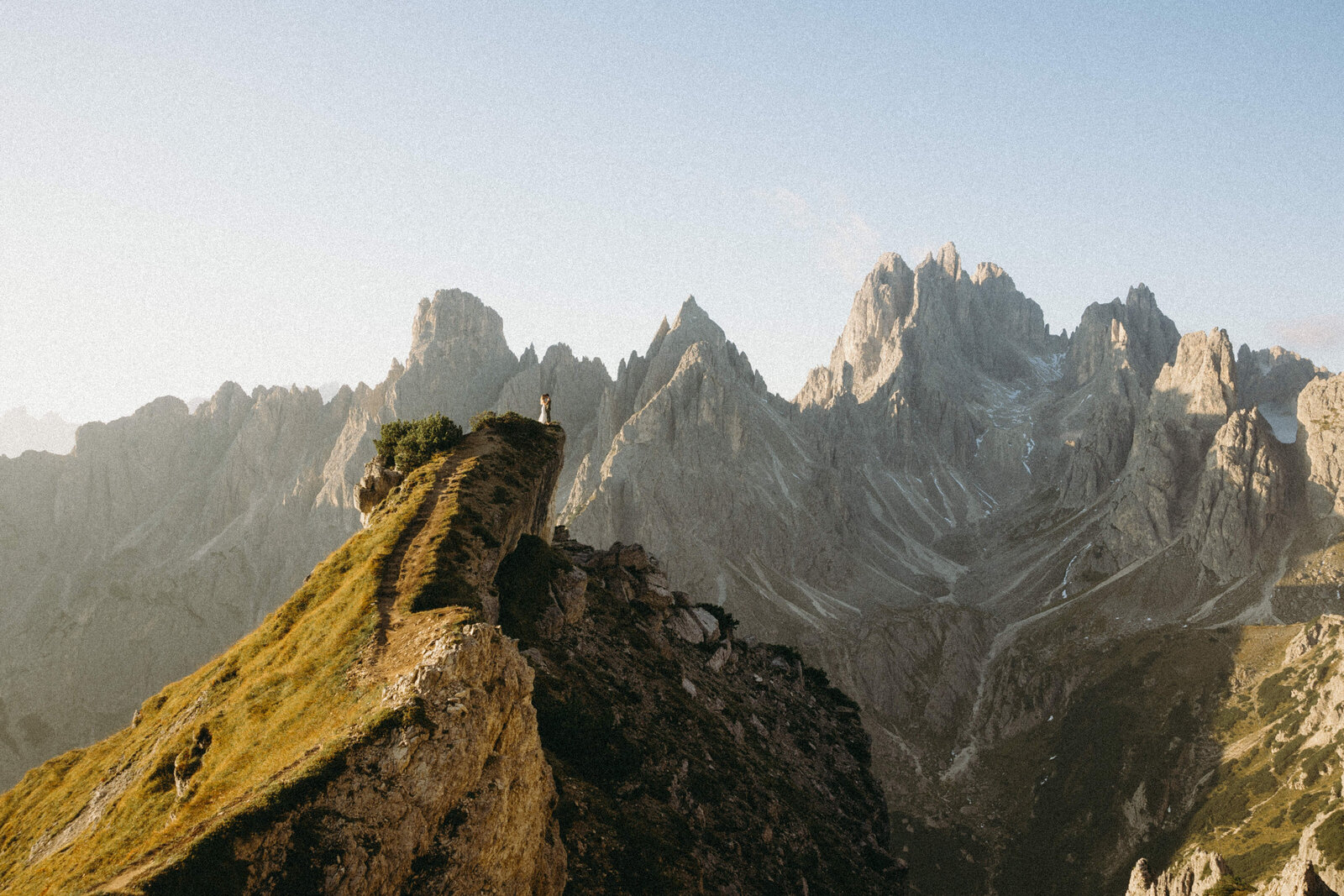 Bride and groom in a breathtaking embrace on their wedding day in the Dolomites.