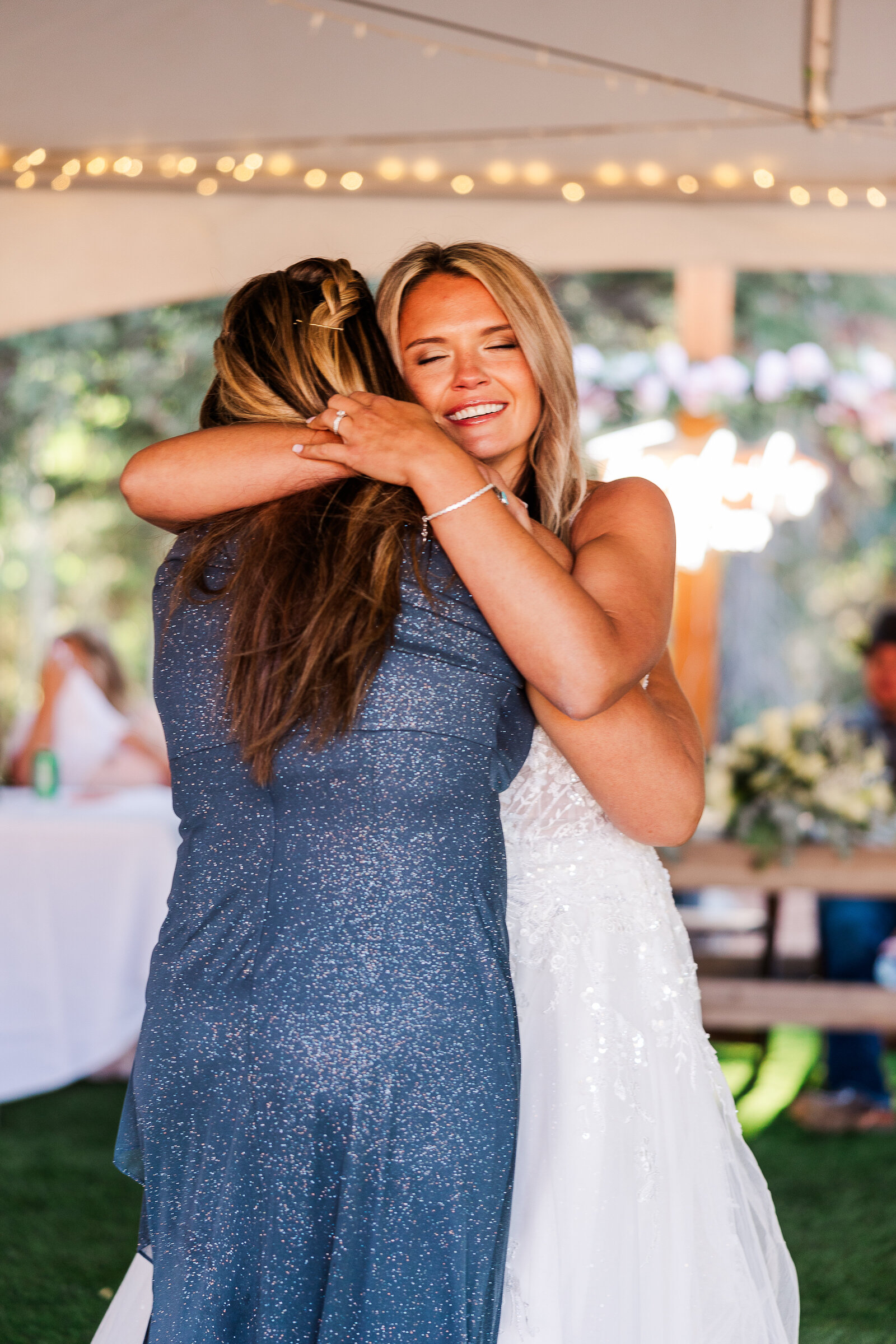 A touching first dance between the bride and her grMother at an Arrowhead Lodge wedding, filled with love and emotion