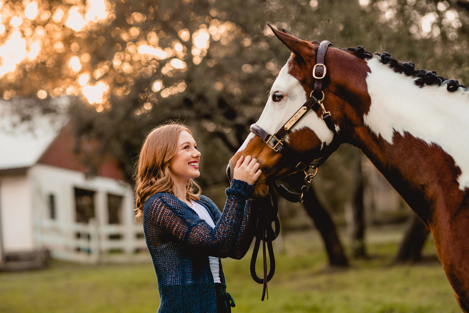 Girl laughing with her horse having fun during her professional photo session in Ocala
