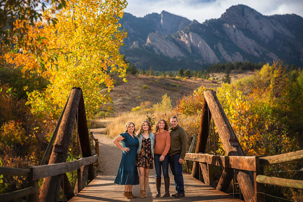 best-fall-family-photographer-when-leaves-change-peak-season-fall-colors-where-photograph-family-photos-colorado-mountain-bridge-family-teenagers