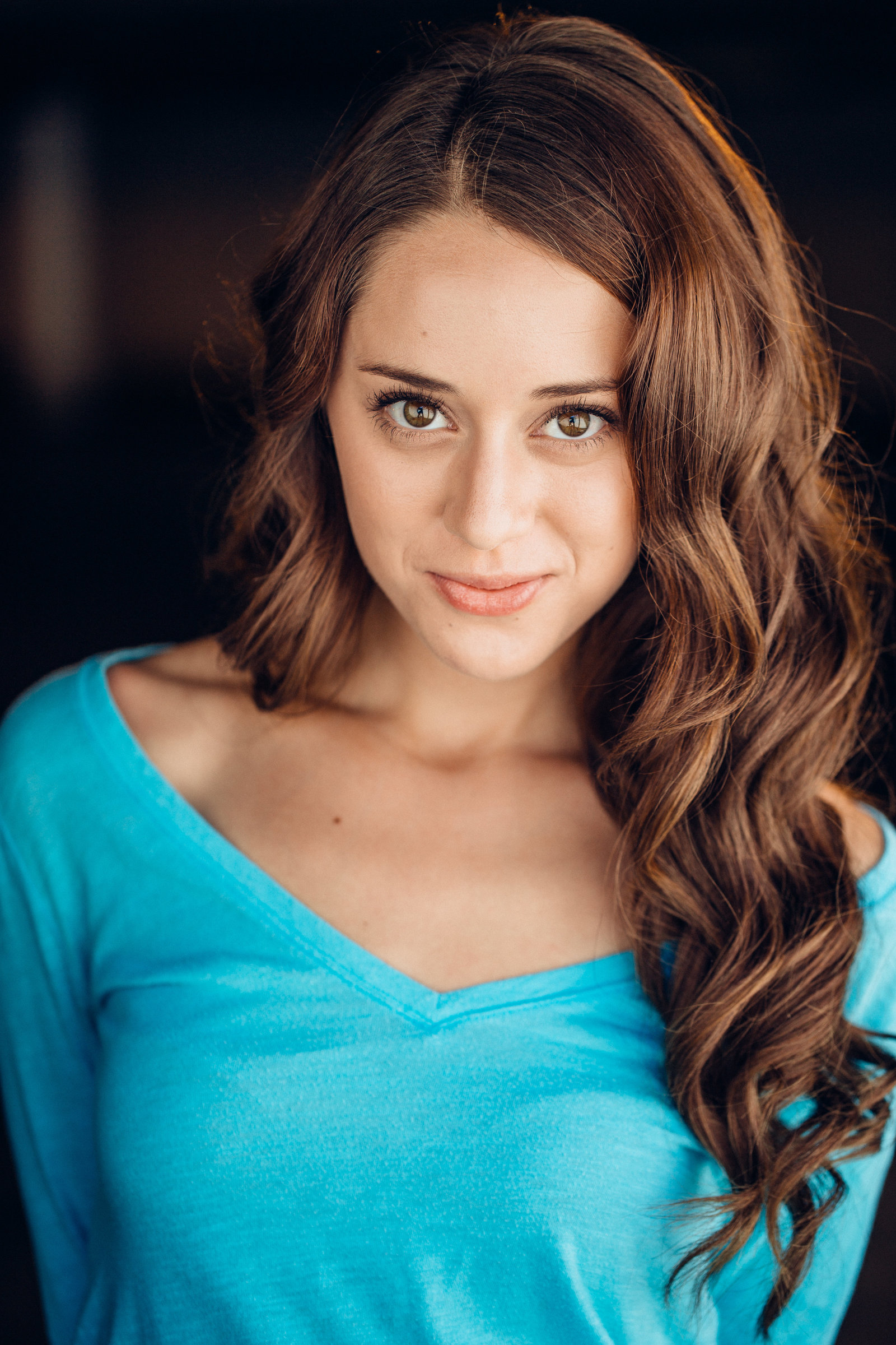 Headshot Photo Of Young Woman In Light Blue Off-Shoulder Blouse