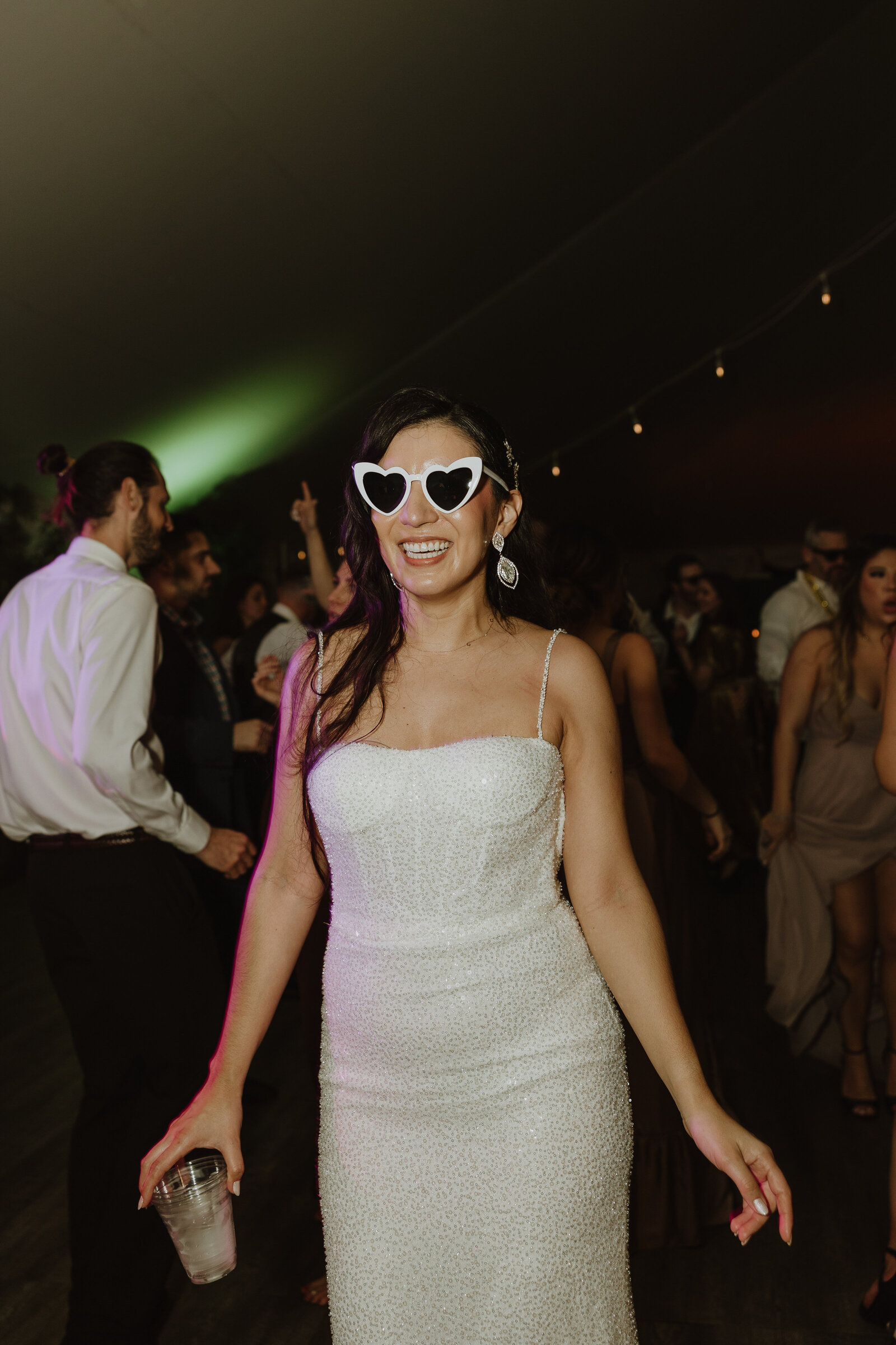 bride on dance floor, bride with sunglasses, reception dress, bride having fun 