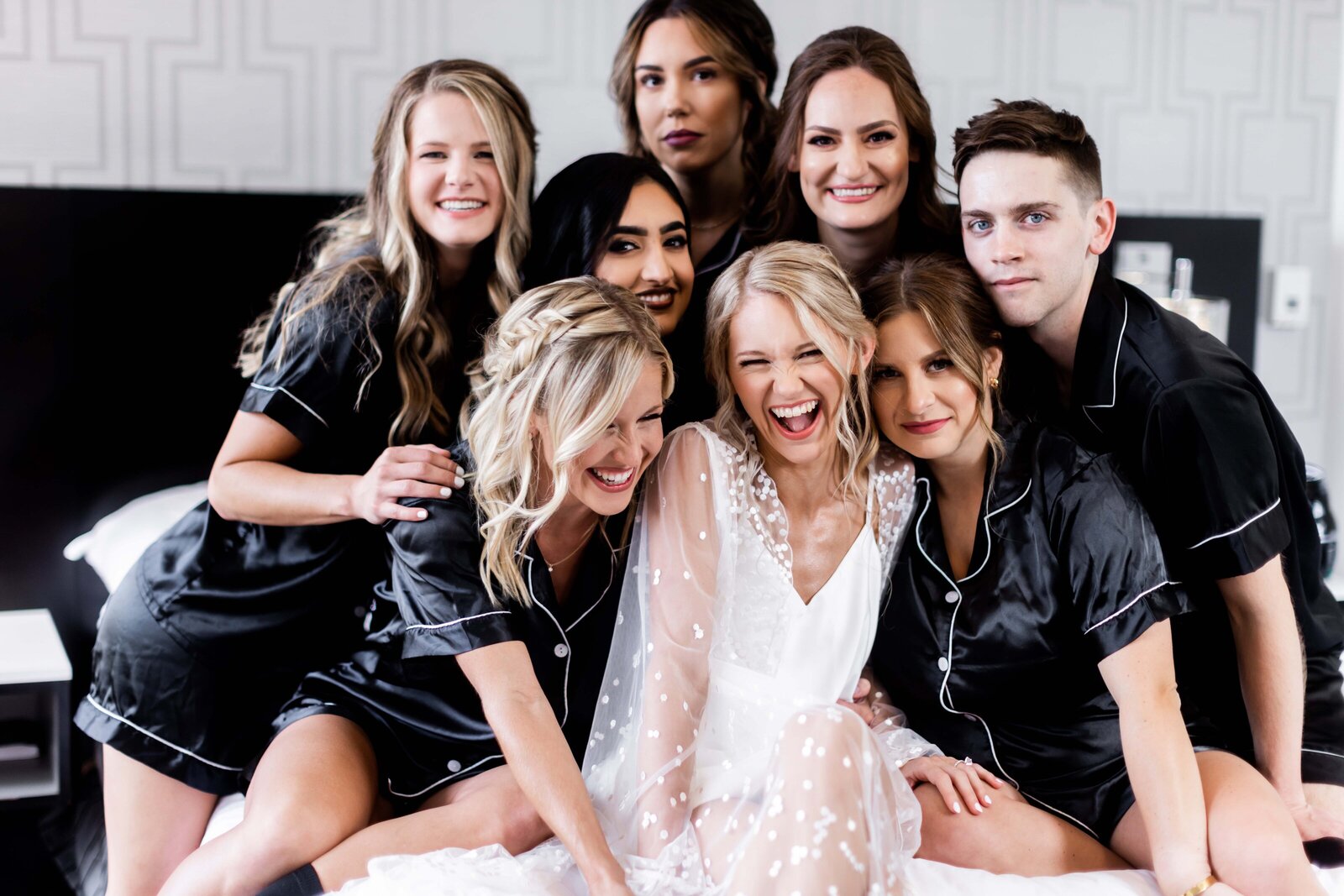 Discover the stylish and fun preparation moments with Hailey and her bridesmaids in matching robes, beautifully captured at her wedding. Our photo captures the joy and excitement of the bridal party getting ready together, highlighting their elegant robes and radiant smiles. Browse our collection for more vibrant and memorable bridal prep photos.
