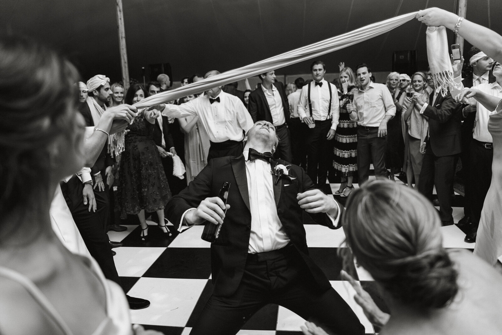 Dance floor fun at a tented reception at Radnor Hunt Landing wedding. 
