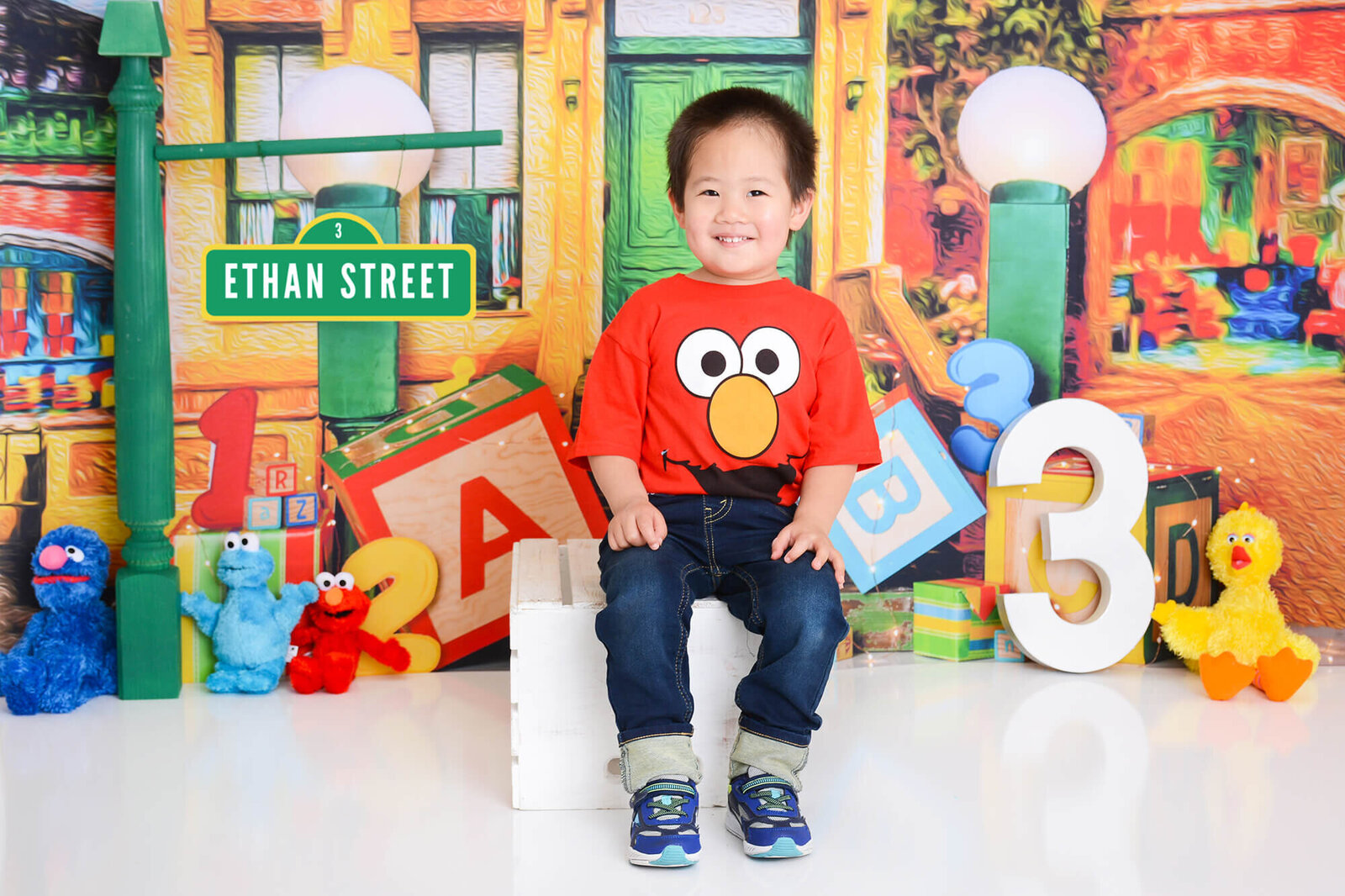 boy smiles at his birthday photosession