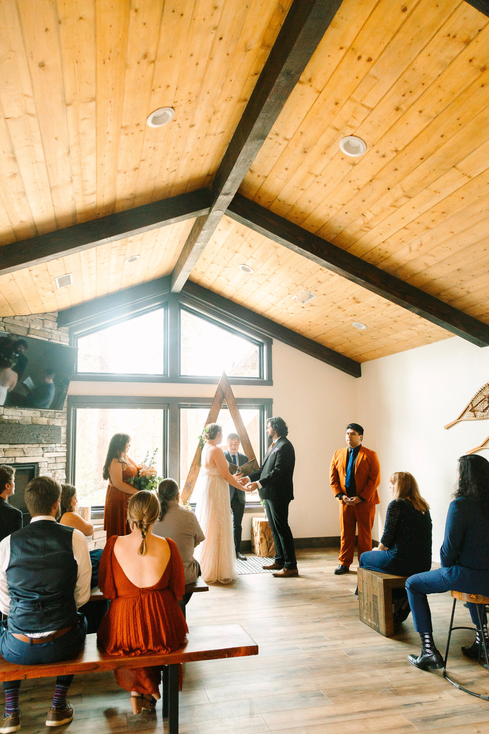 A couple celebrates their intimate elopement at a cabin at Big Bear Lake, California.