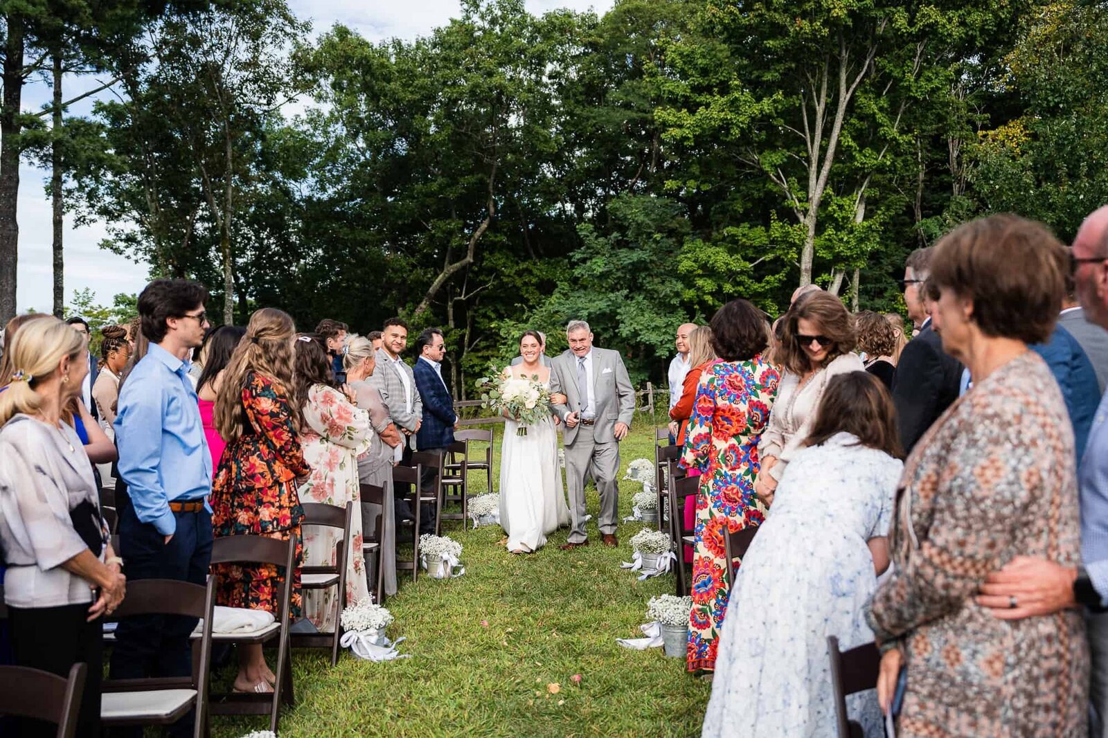 Allie and her father walking down the aisle at terra incognita vineyard wedding