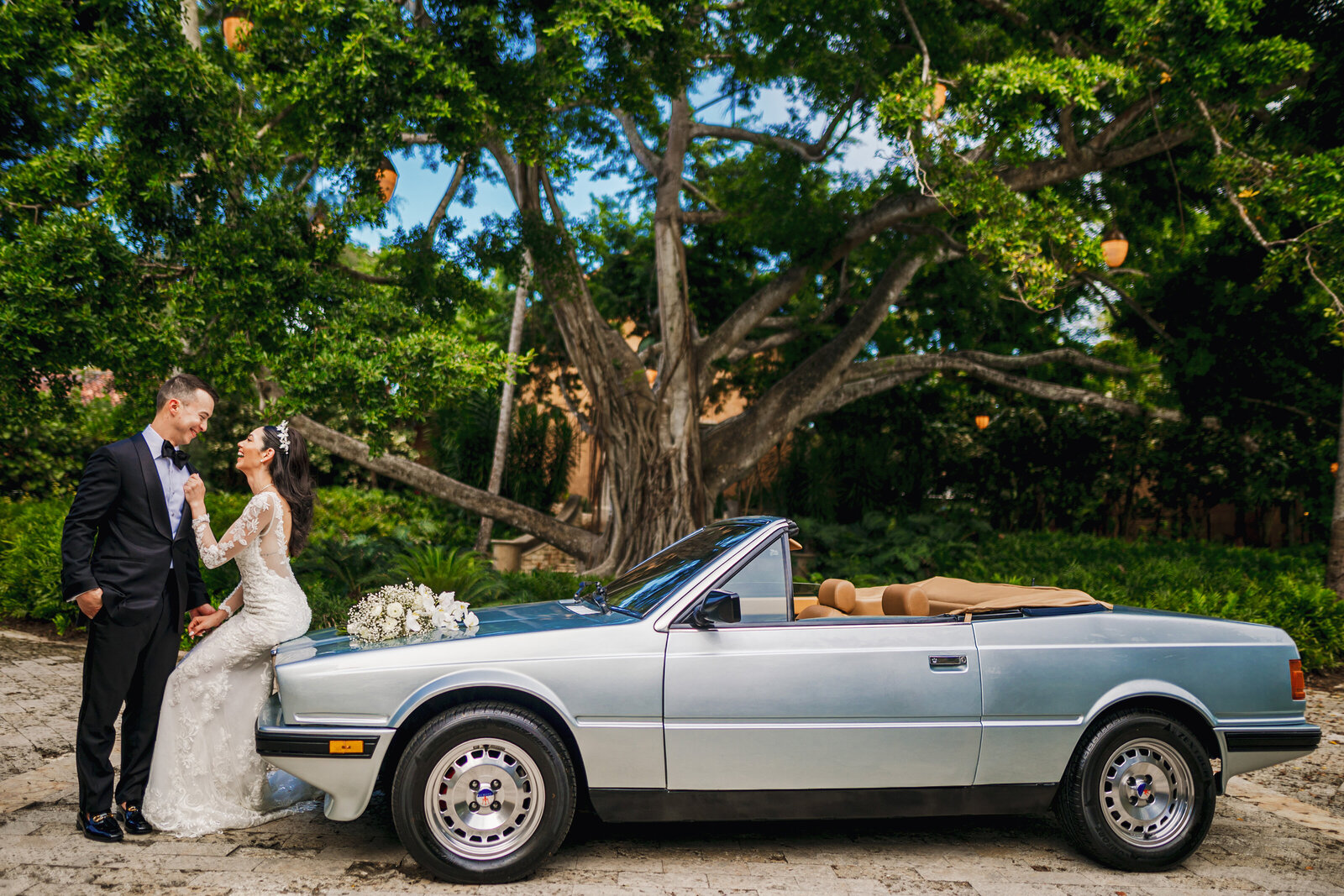 A bride and groom in front of the 100-year-old ficus tree in Dorado Beach Ritz-Carlton Reserve, Puerto Rico