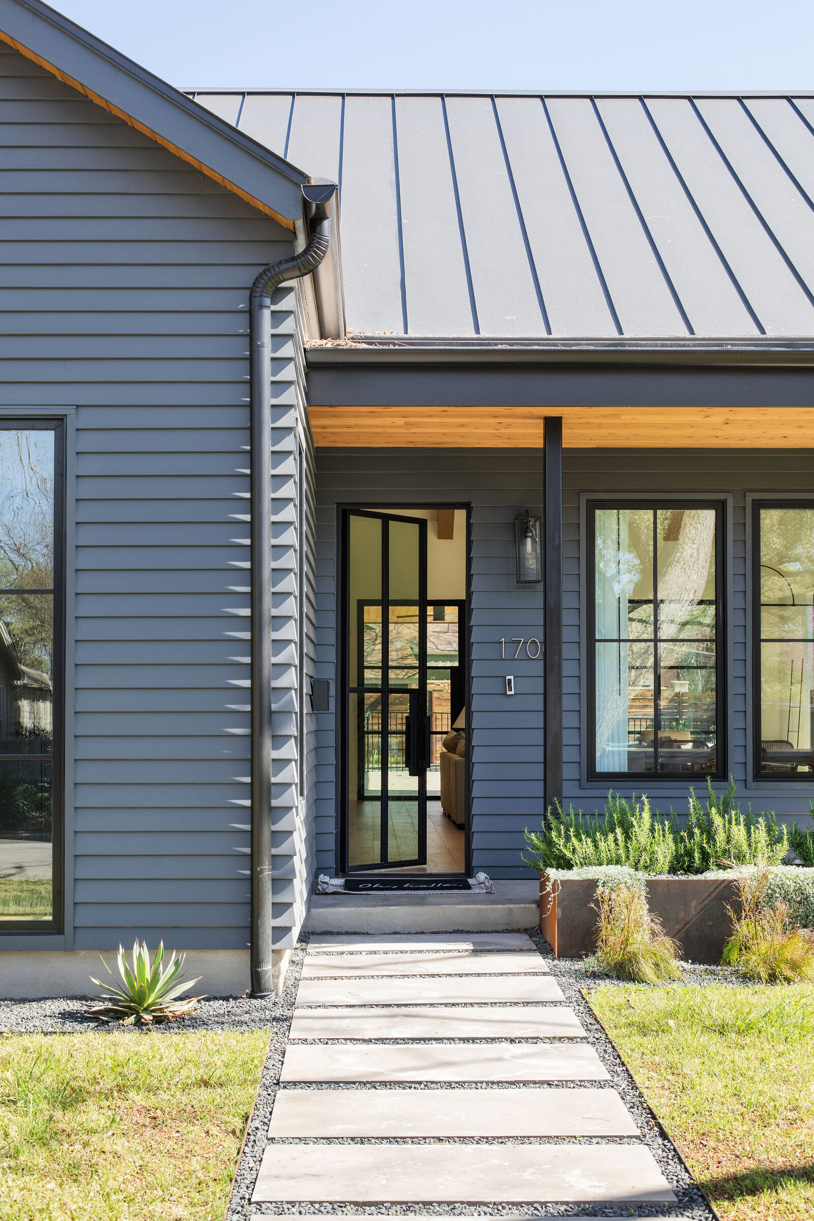 Modern Navy Home with wood soffit_Nuela+Designs