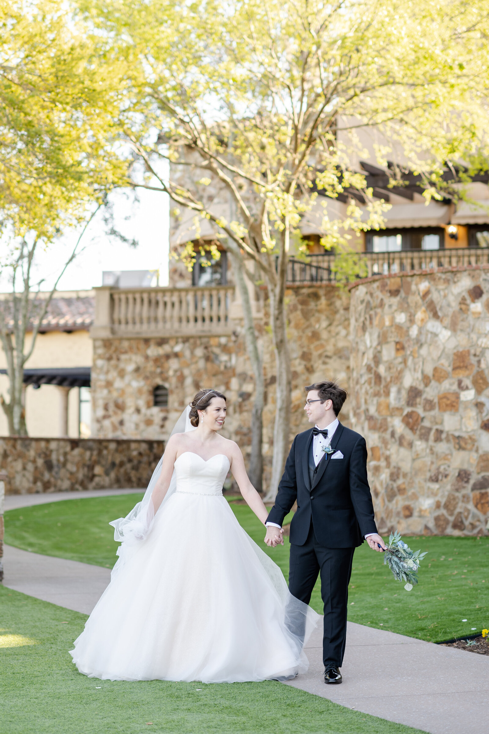 Bride and groom walk together Riley James Photography.