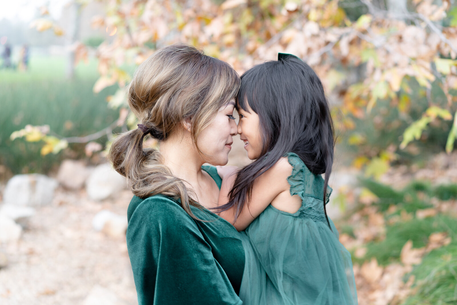 mother daughter portrait with fall background