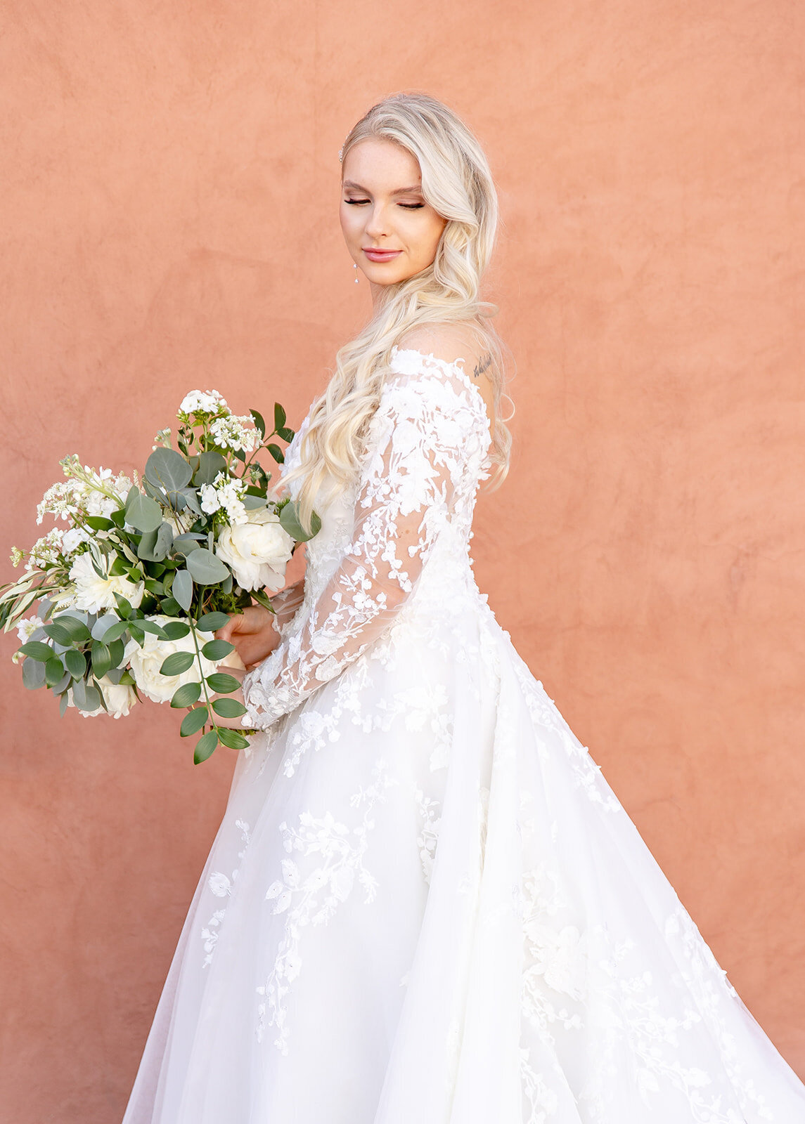 beautiful bride holding her wedding flowers