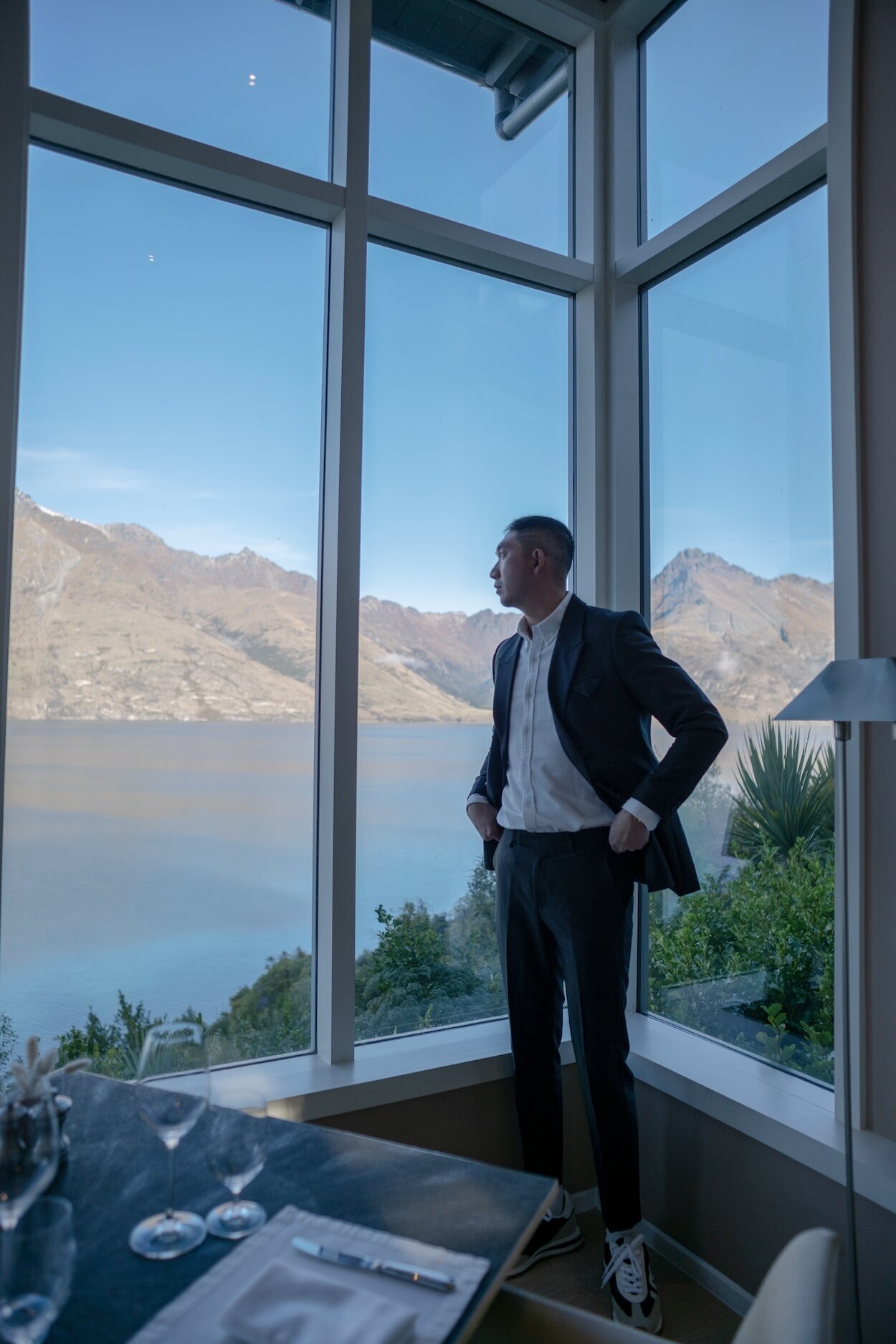 Prescott photographed in a lake view home looking out the windows towards the Queenstown mountains.