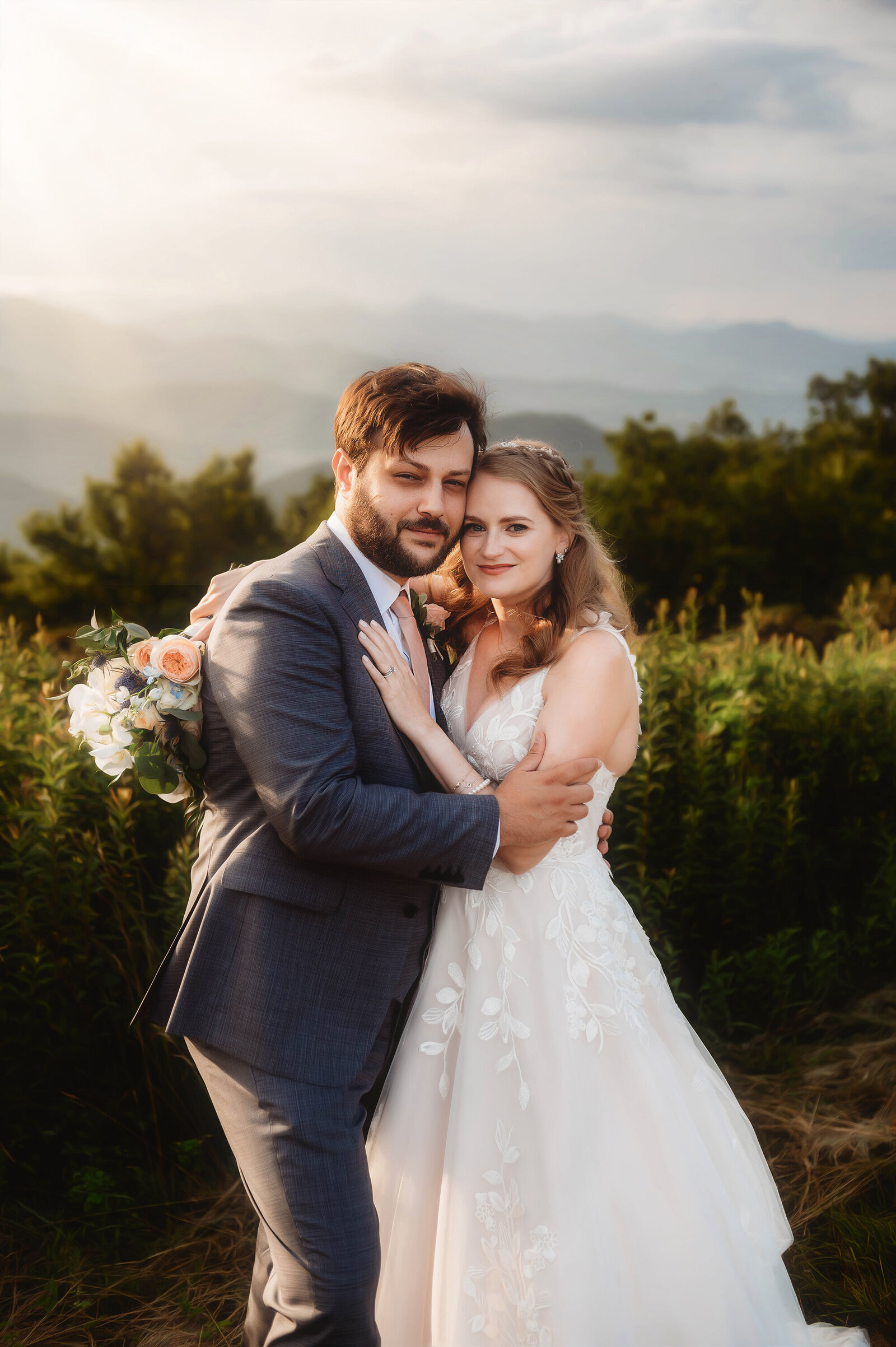 Bride and Groom embrace during their Elopement on the Blue Ridge Parkway in Asheville, NC.