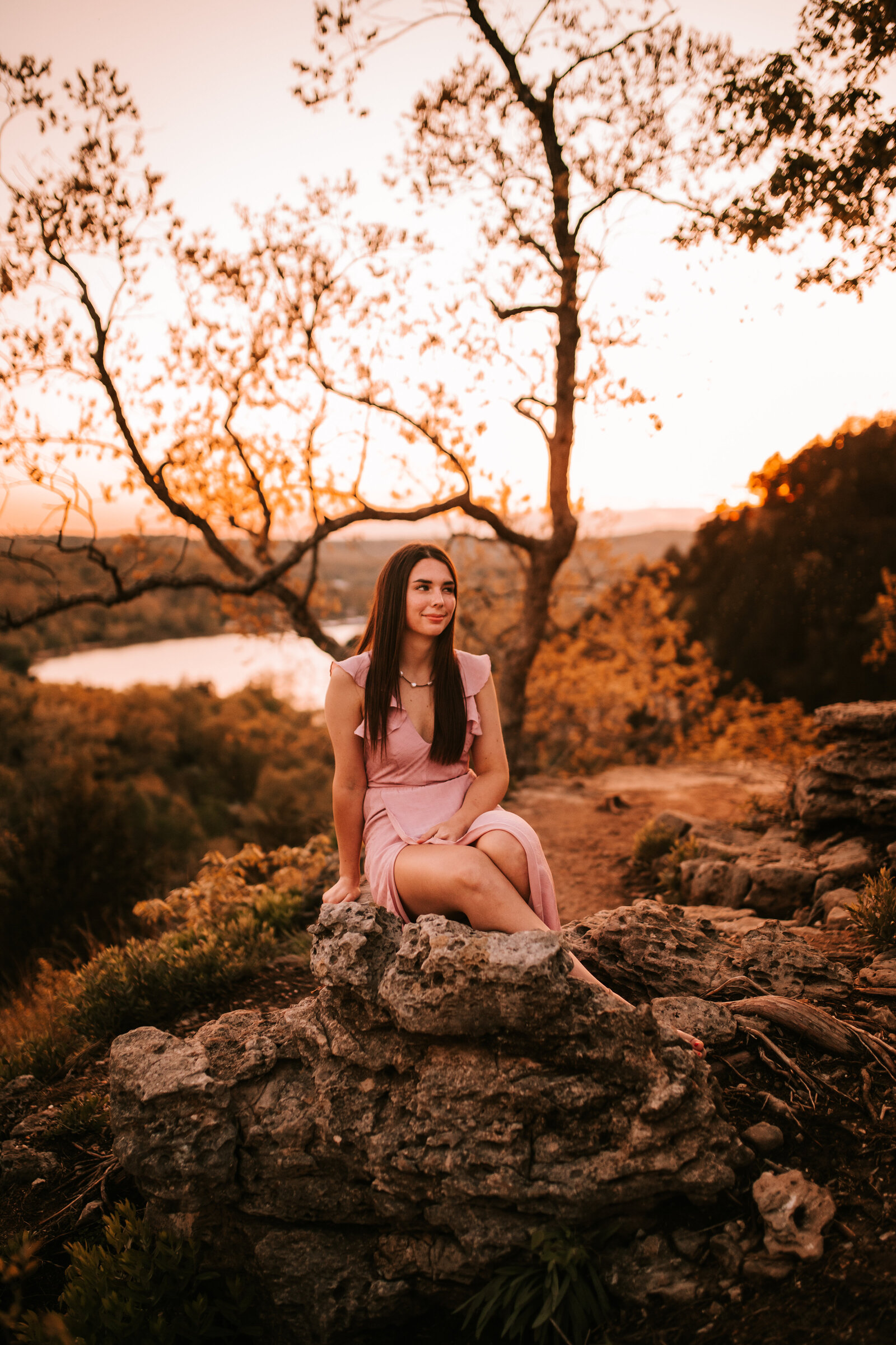 senior session in hills with water in the background