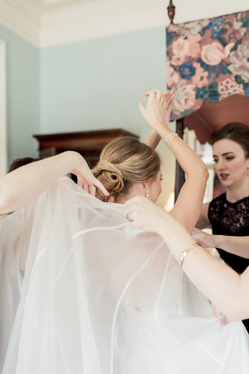 Bride gets into her dress, John Rutledge House Inn, Charleston, South Carolina