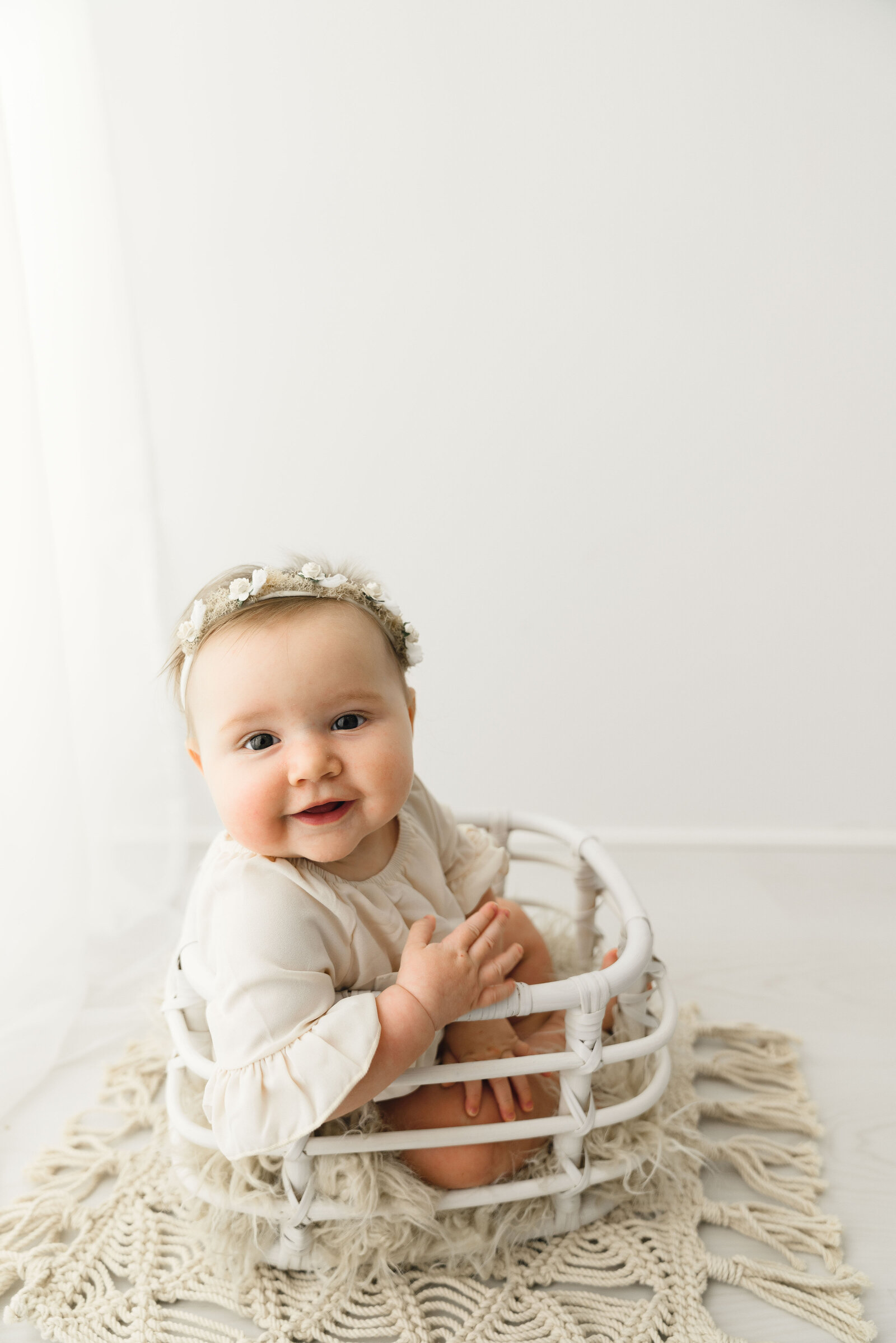 baby in white basket