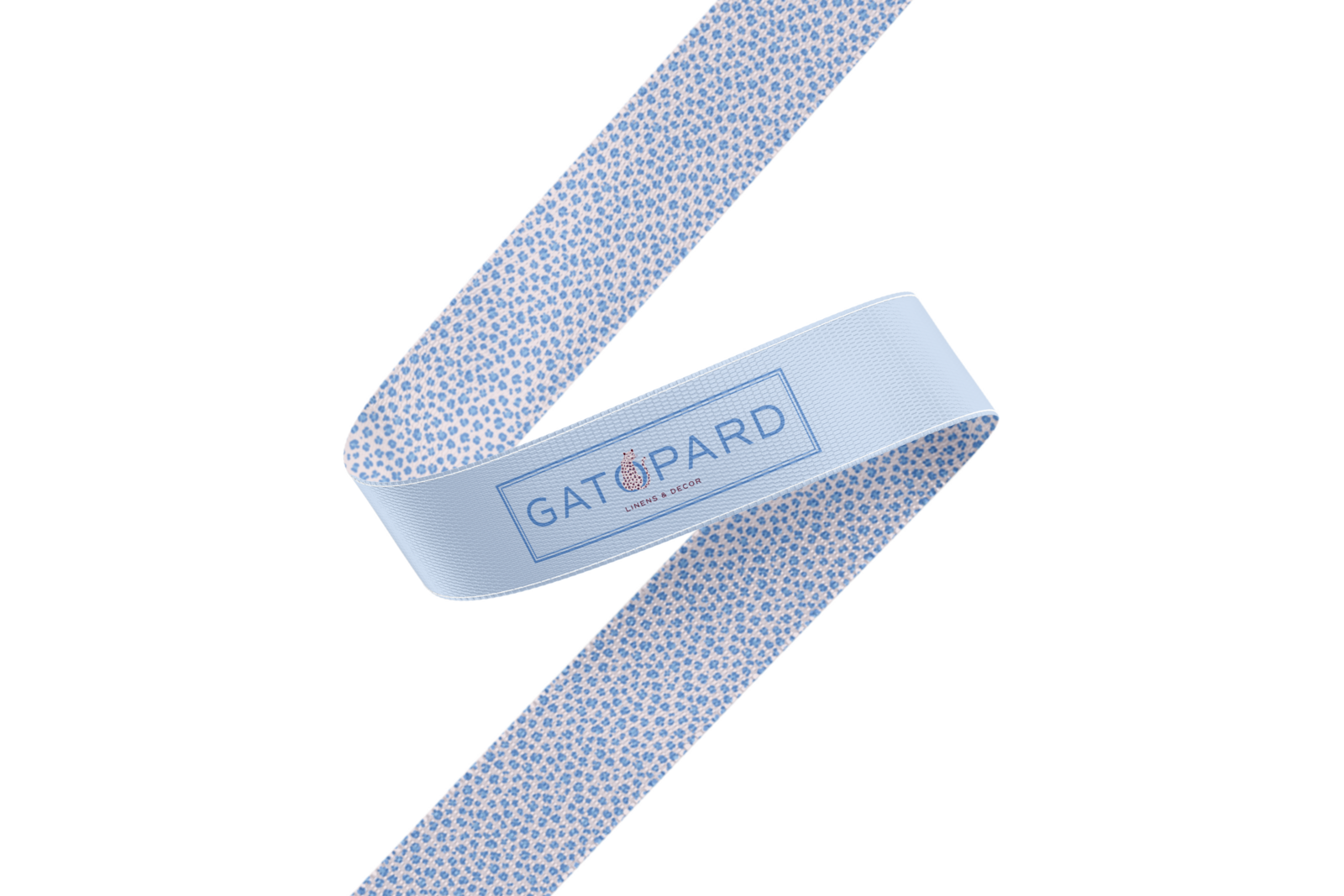 Blue and blush leopard print ribbon with rectangular Gatopard Linens & Decor logo