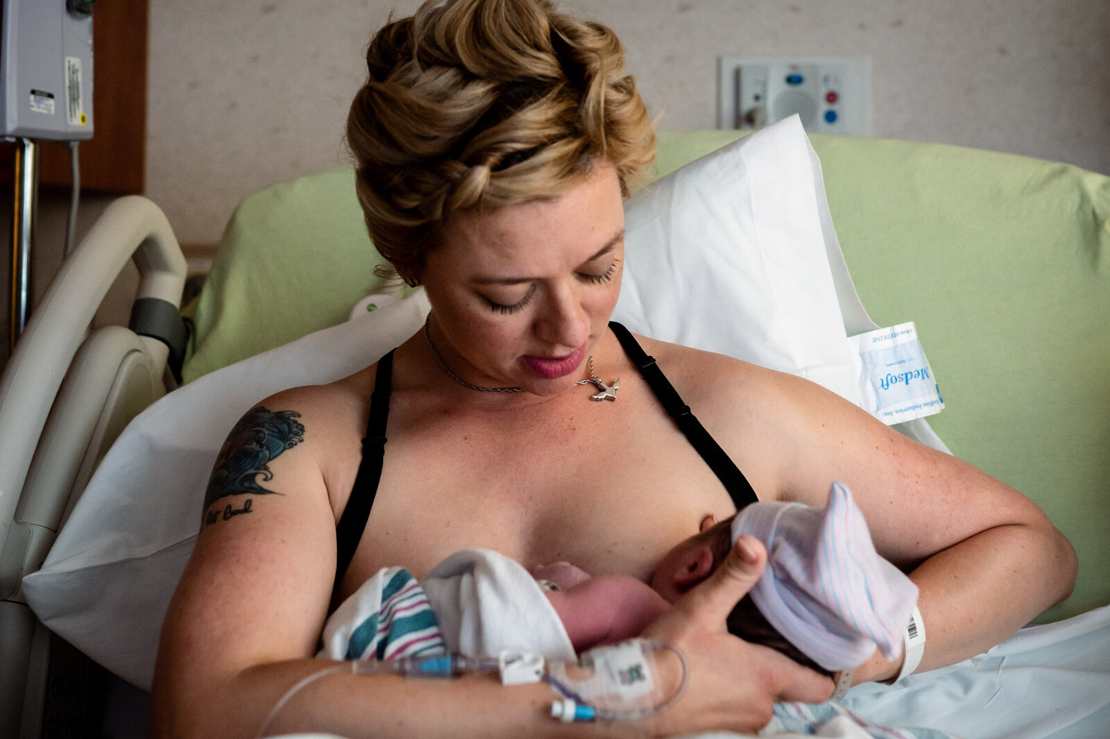 mom breastfeeds newborn at Methodist Hospital in San Antonio