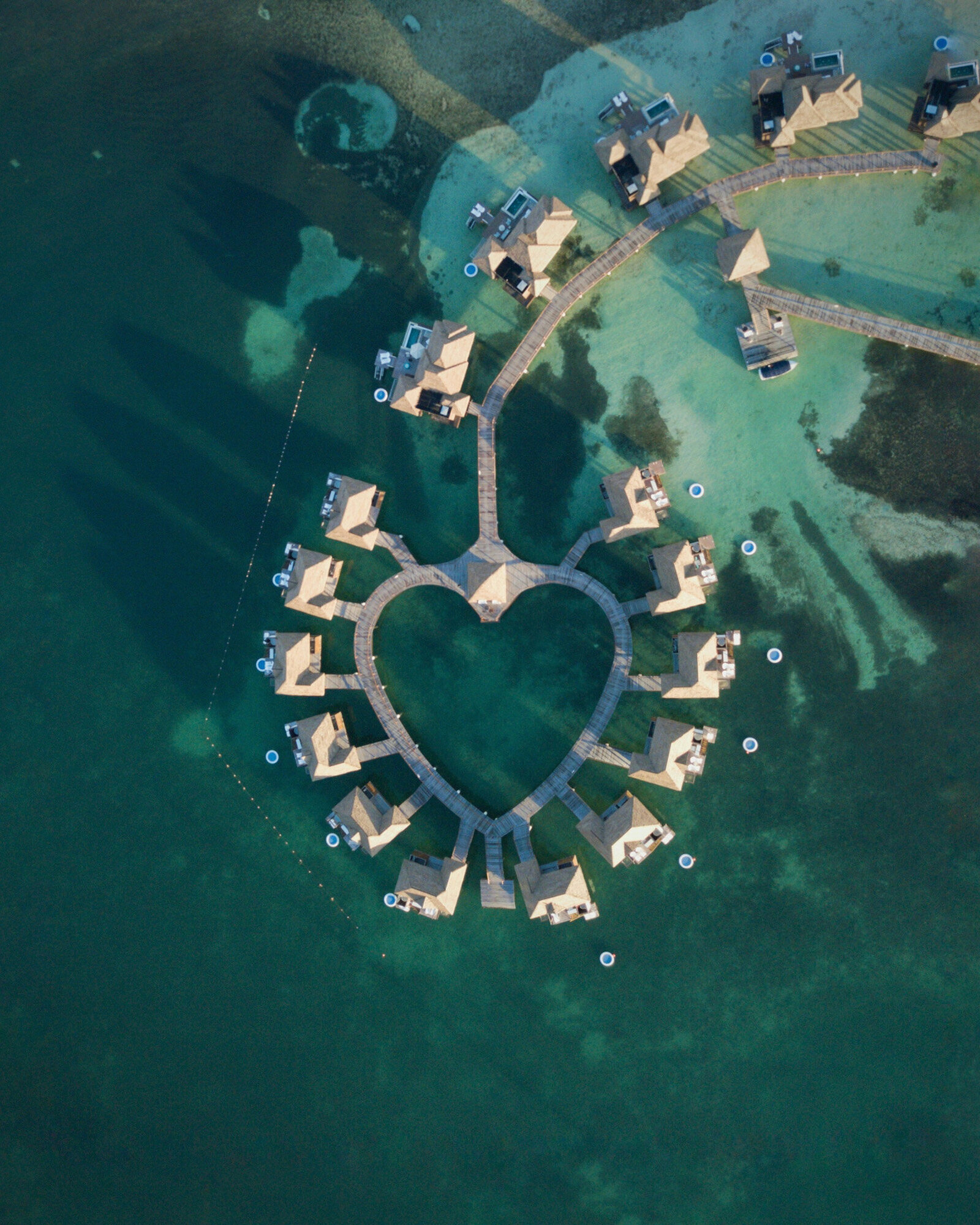 Luxurious resort with cottages that forms a heart shape