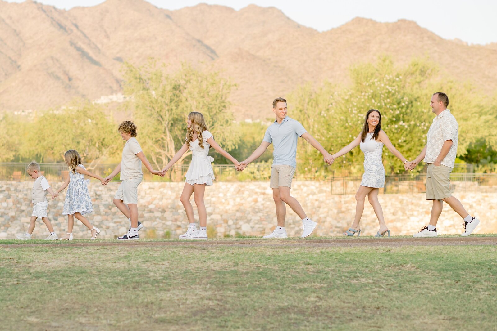 family walking in the arizona desert in a line