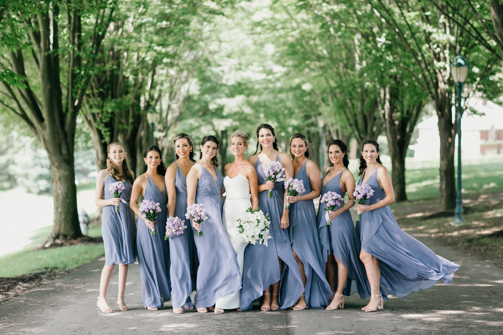 Our bride Jessica, gathered around by her bridesmaids at Overbrook Golf Club wedding venue  in Villanova, PA.