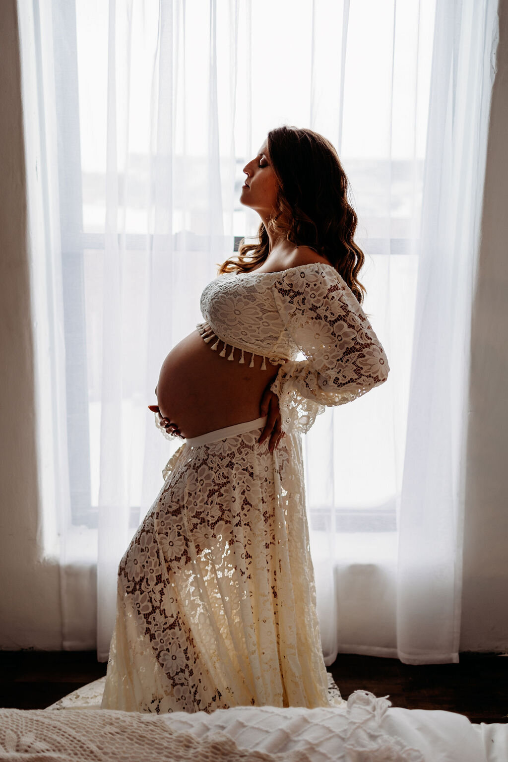 Pregnancy silhouette in a gorgeous  two piece floral cream gown