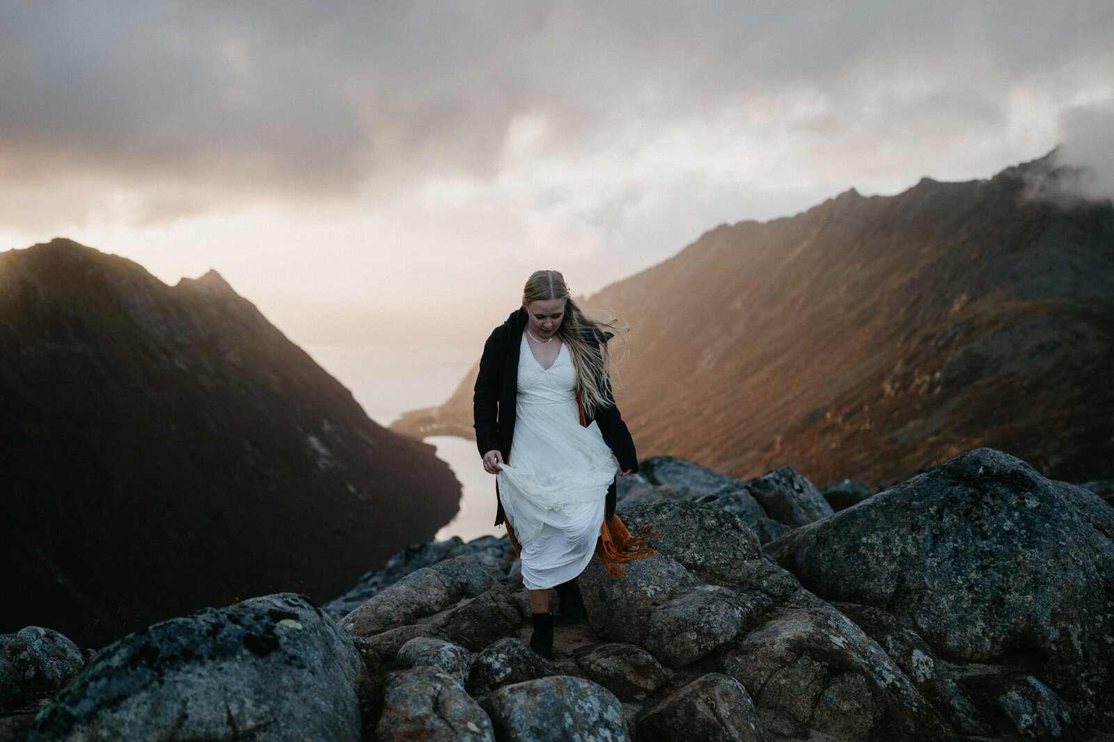 Bride walking up in a mountain