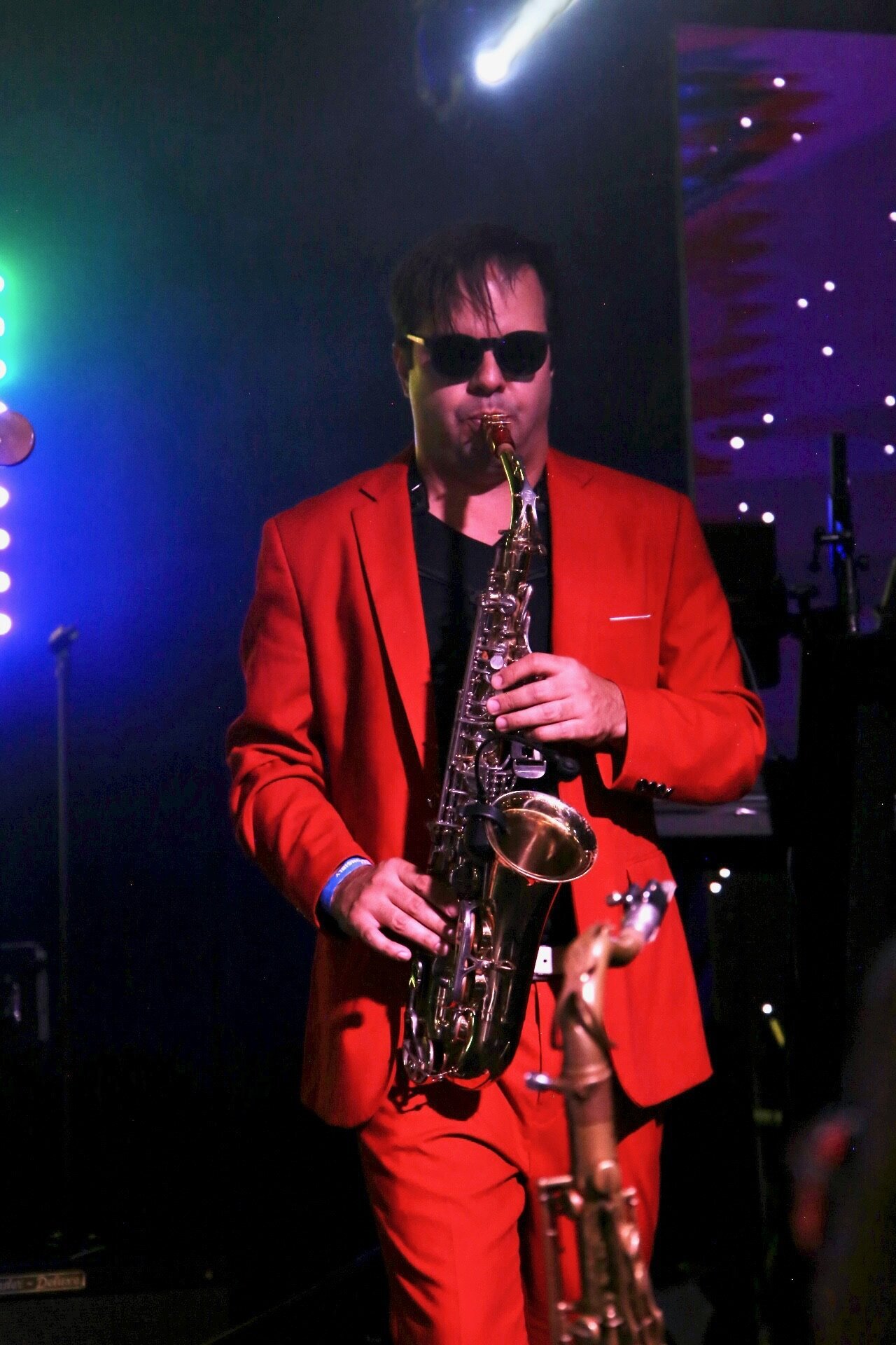 Stephen Saxy Herring red suit 2