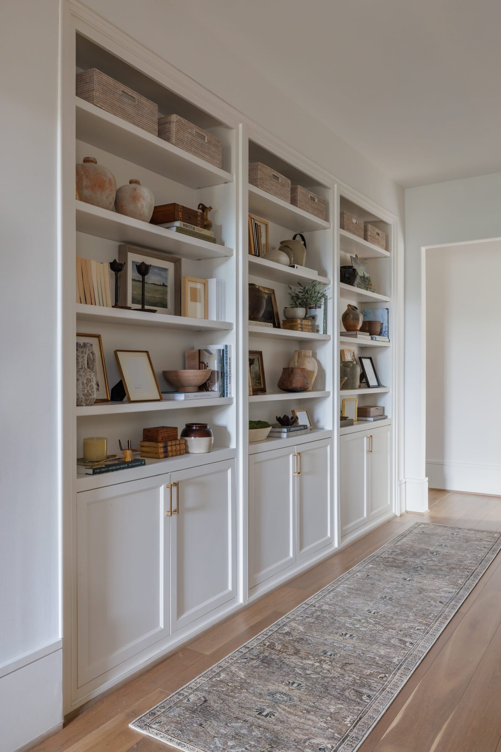 vision and hammer white styled shelves with runner rug