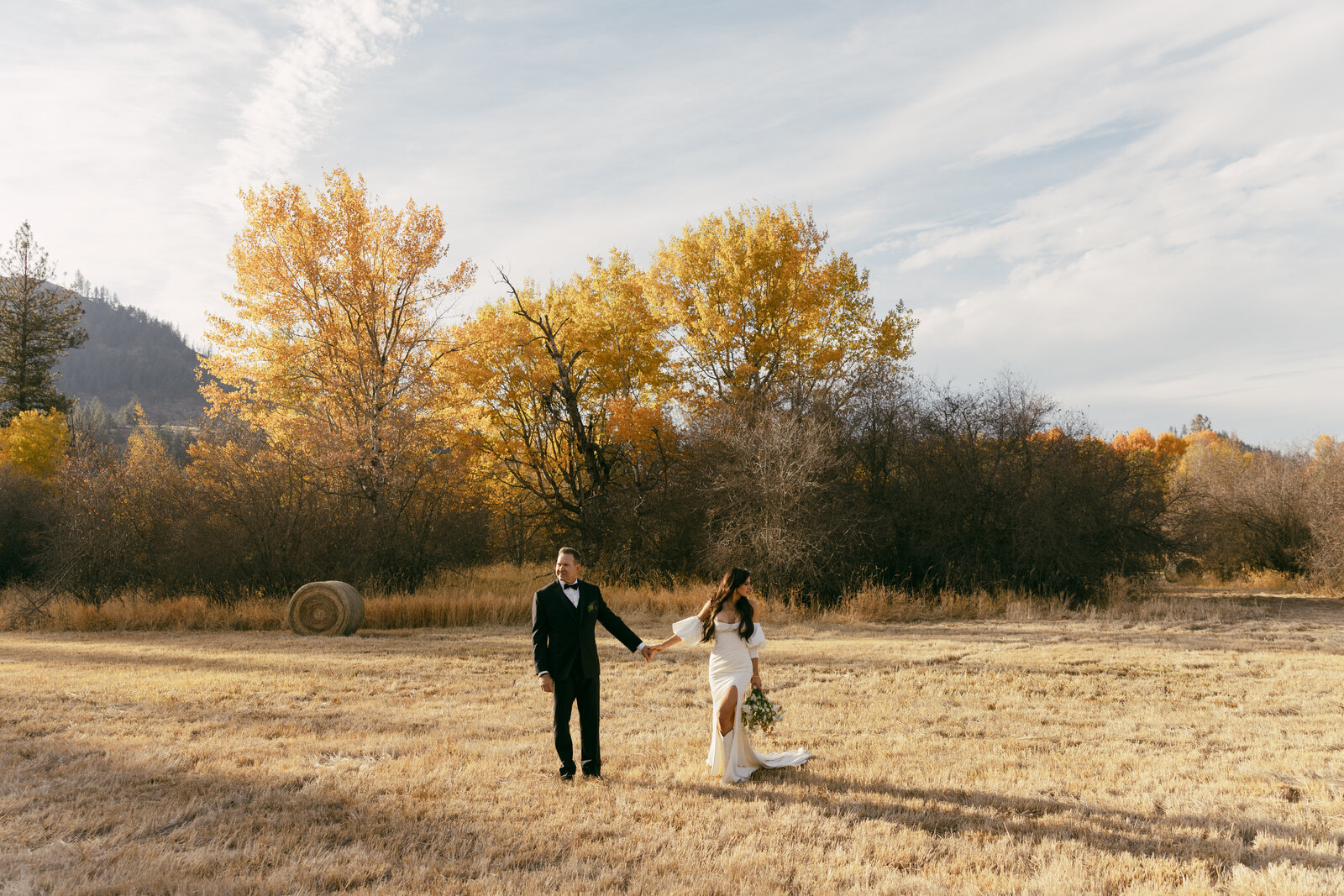bride and groom in field