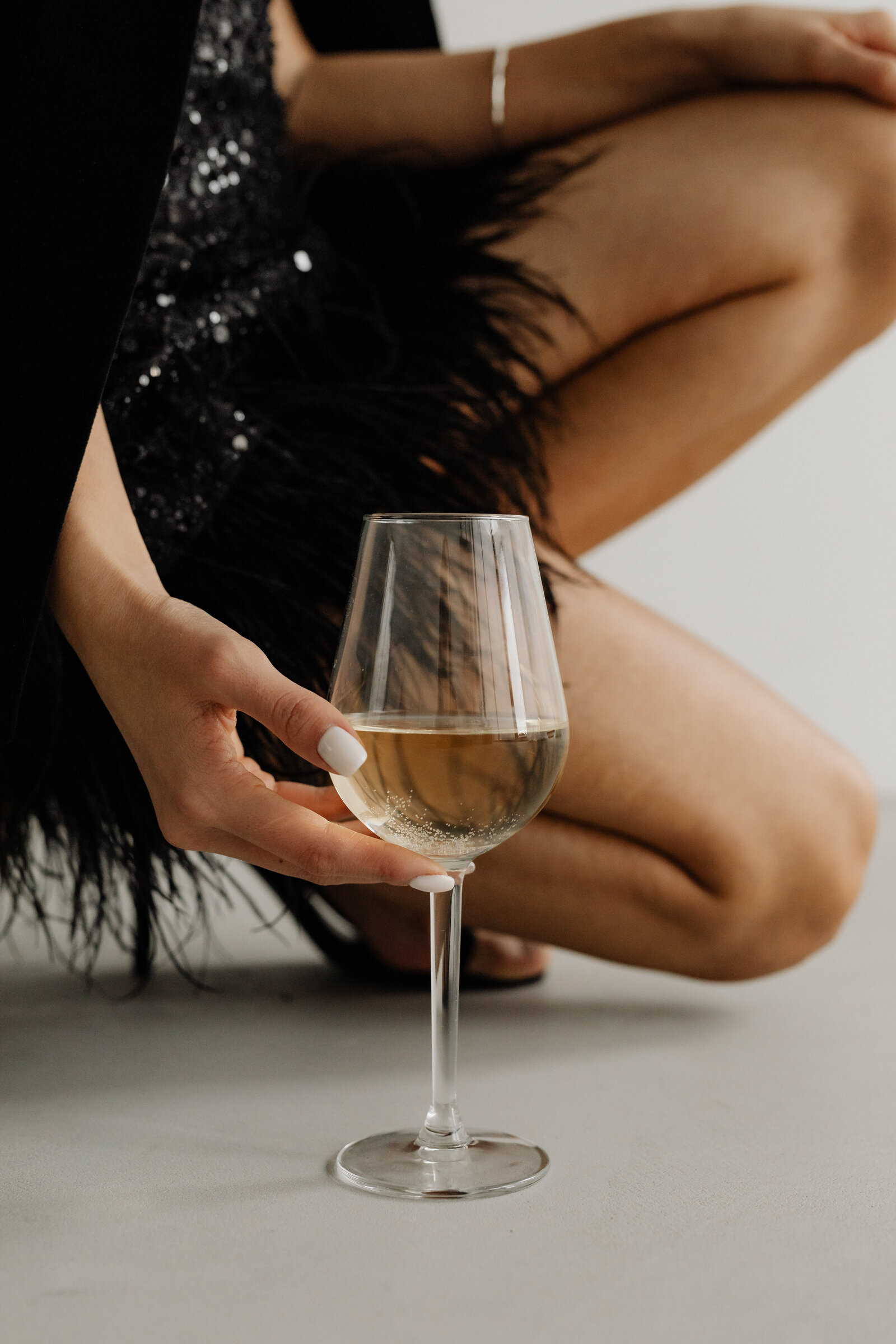 kaboompics_classy-aesthetics-beautiful-asian-woman-in-black-evening-dress-white-wine-in-a-glass-29527