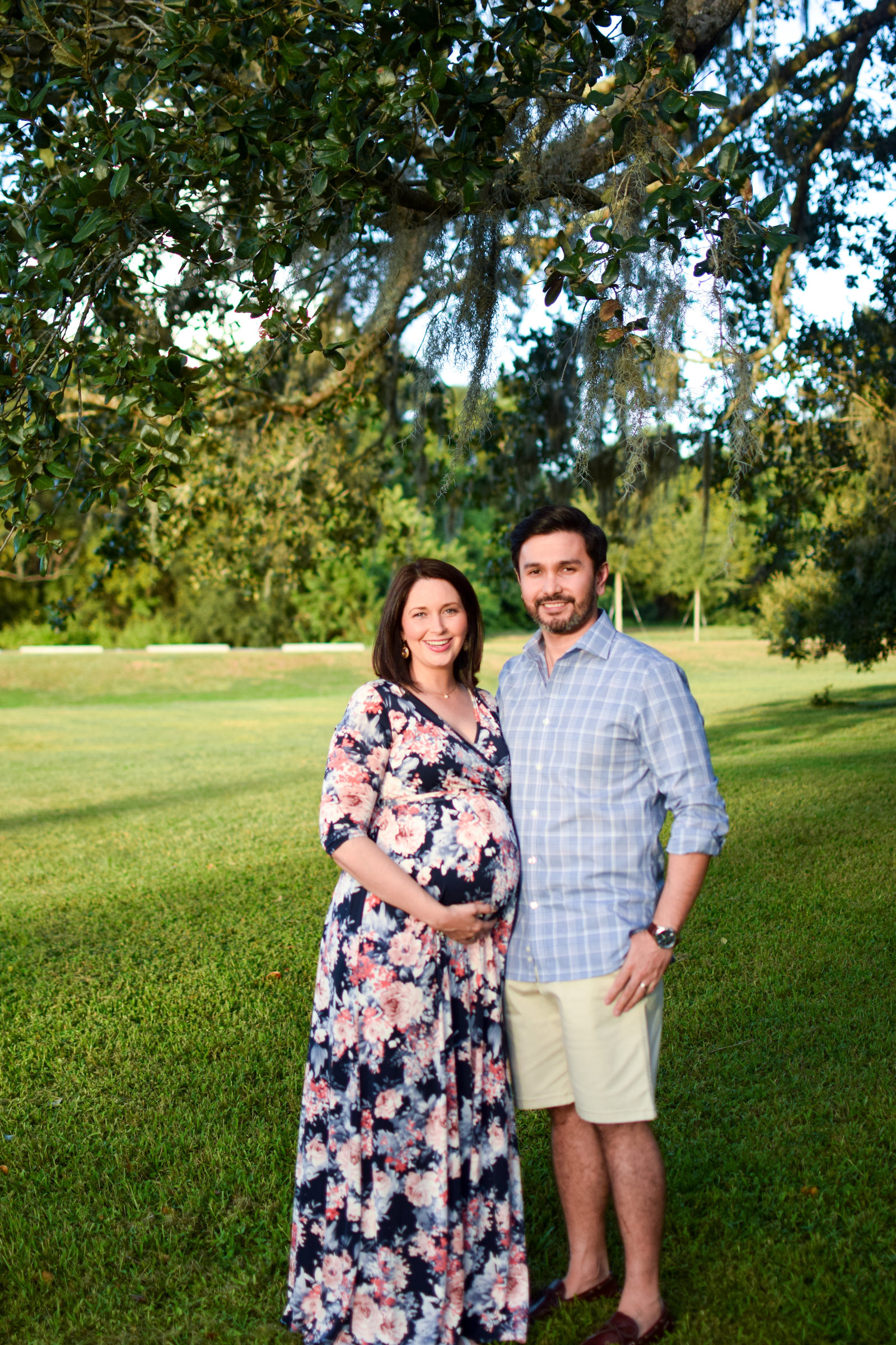 Maternity pregnant couple smiling Tucker Ranch Winter Garden Florida