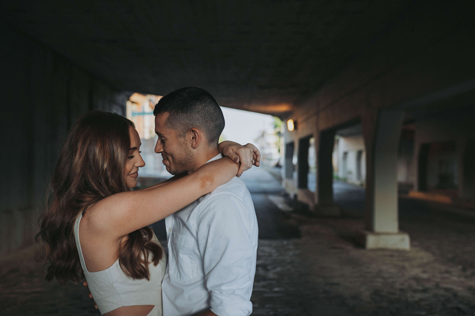 A couple dances together under a bridge in downtown in Memphis.