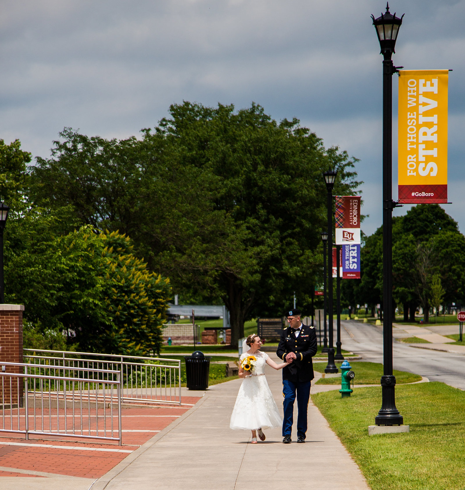 Bride and groom walk the campus of Edinboro University