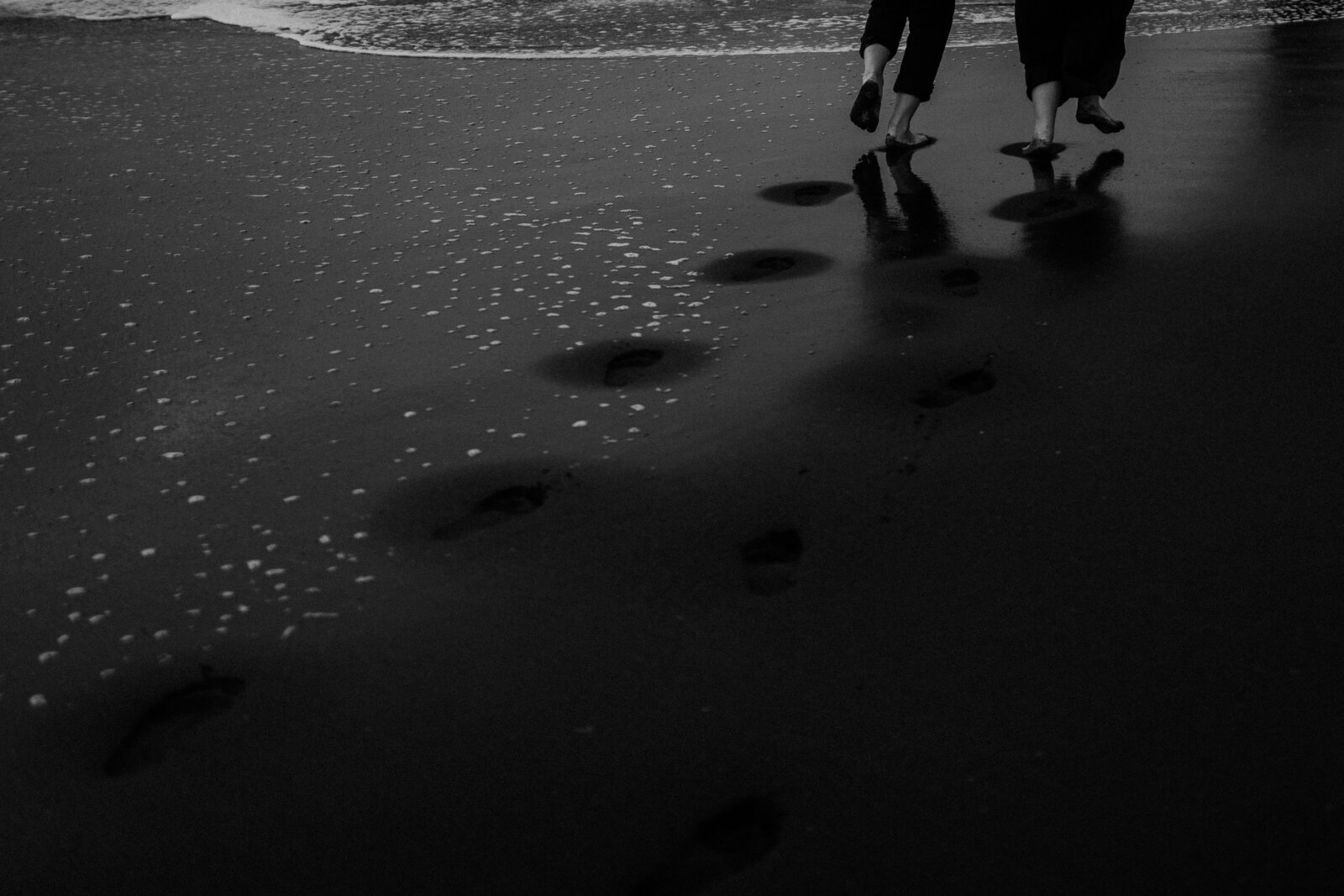 couple foot running on bali beach